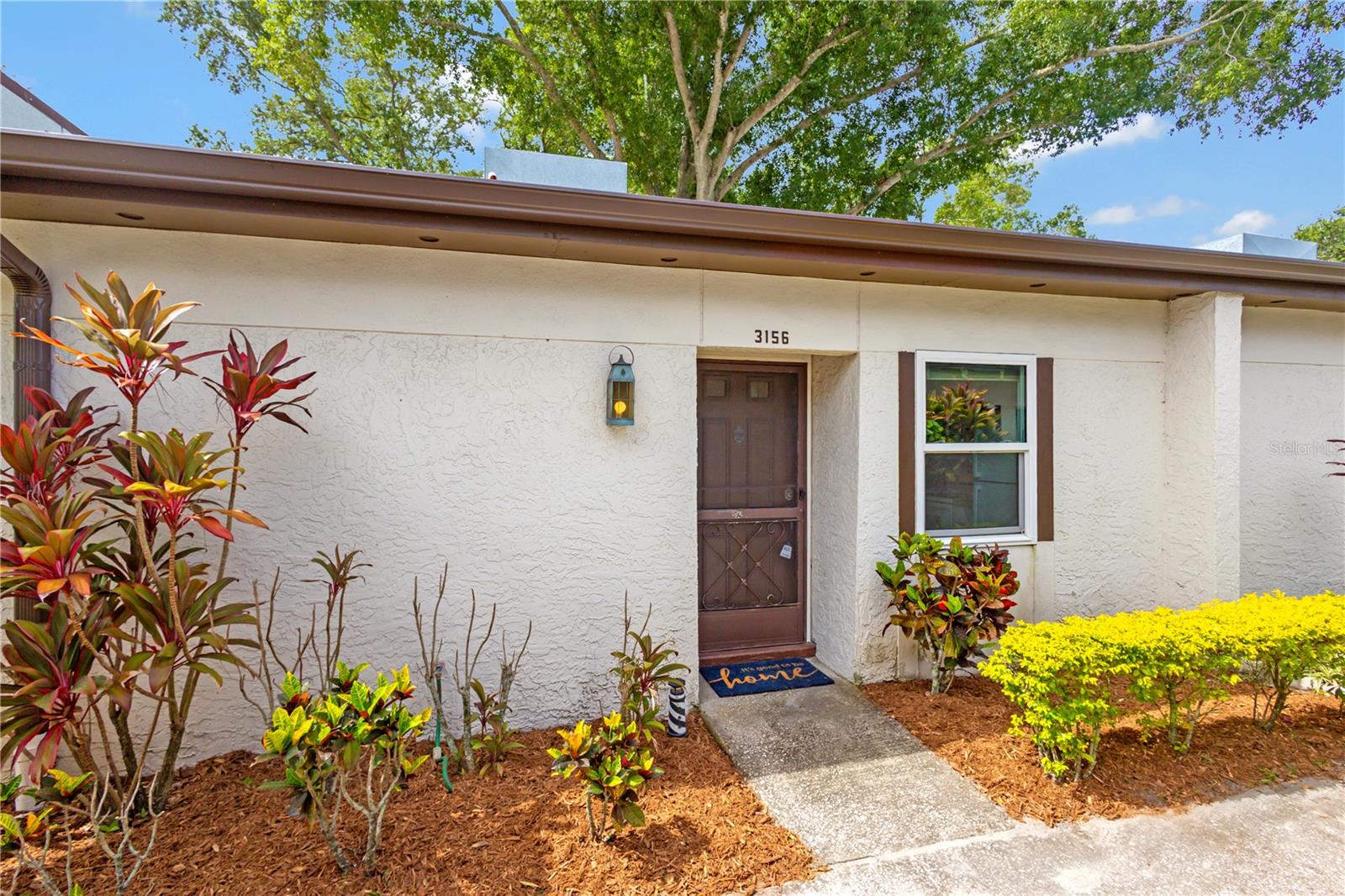 Virtually Staged. Relax and unwind and begin living your carefree lifestyle in this 1-Bed 1 Bath Villa style condo located in Highland Lakes Mission Grove Condo Community.  Enjoy peaceful mornings and relaxing evenings in the enclosed lanai overlooking a beautifully landscaped green space. Convenience is built in with a private carport to park your car or golf cart and an attached storage closet, providing extra space for bikes, beach gear, tools, and more. Monthly fees include unlimited golf, two clubhouses each with their own swimming pool, tennis courts, shuffleboard, access to scenic Lake Tarpon, and countless social events, activities, and clubs designed to fit every interest and lifestyle. Updates: 2022 PGT Hurricane Impact Custom Windows "Low E" throughout the unit, Handicap Bars installed in the bathroom shower, Microwave 2021, Top Mount Fridge 2022, and HVAC replaced 11/2025. This corner villa offers the perfect blend of comfort, community, and low maintenance living whether you are looking to downsize, an investment property, or a seasonal vacation home.  This community is sure to make you feel right at home.  High and Dry/ NON-Evacuation Zone/ X Flood Zone. Conveniently located close to shopping centers, Gulf Beaches, restaurants, and approximately 16 miles from Tampa International Airport making travel easy for seasonal residents and visitors.
Schedule your showing today!!! No carpet here, Move-in Ready, and priced to sell. Begin living the Active Adult Lifestyle you deserve!!