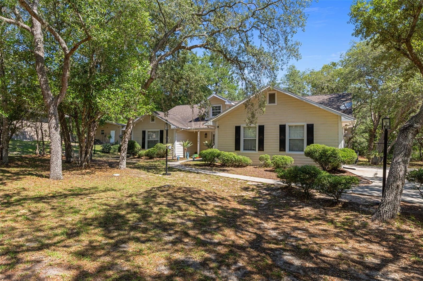 Welcome to this beautifully custom-built 3-bedroom, 2.5-bath home nestled on a picturesque 1-acre homesite in the highly desirable Presidential Estates of Citrus Hills — with no mandatory HOA! Combining comfort and modern upgrades, this meticulously maintained residence offers an exceptional lifestyle both inside and out. Step inside to discover a freshly updated interior, completely painted in 2022, creating a bright and inviting atmosphere throughout. The spacious floor plan is complemented by an oversized 2-car garage and thoughtful upgrades designed for everyday convenience and style. The guest bath has been tastefully remodeled with a modern floating vanity, updated faucet, light fixture, and towel holders, while the primary bath features a new sink, faucet, mirror, and accessories for a fresh contemporary feel (2022). The heart of the home is the beautifully updated kitchen, showcasing a new center island, new faucet, stainless steel refrigerator and dishwasher installed in 2022, and a premium KitchenAid stainless steel oven with built-in air fryer added in 2025 — great for entertaining or preparing meals with ease. New door handles throughout the home add an elegant finishing touch. Outside, enjoy added security with a 14-foot wide by 9-foot high automatic driveway gate equipped with WiFi/app connectivity and two key fobs for seamless access. Modern smart features continue inside with motion-sensor lighting in the garage, pantry, and primary bedroom. Surrounded by peaceful natural beauty yet conveniently located near to shopping, dining, golf, and all the amenities Citrus Hills has, this exceptional property delivers the perfect blend of tranquility, space, and modern living.
