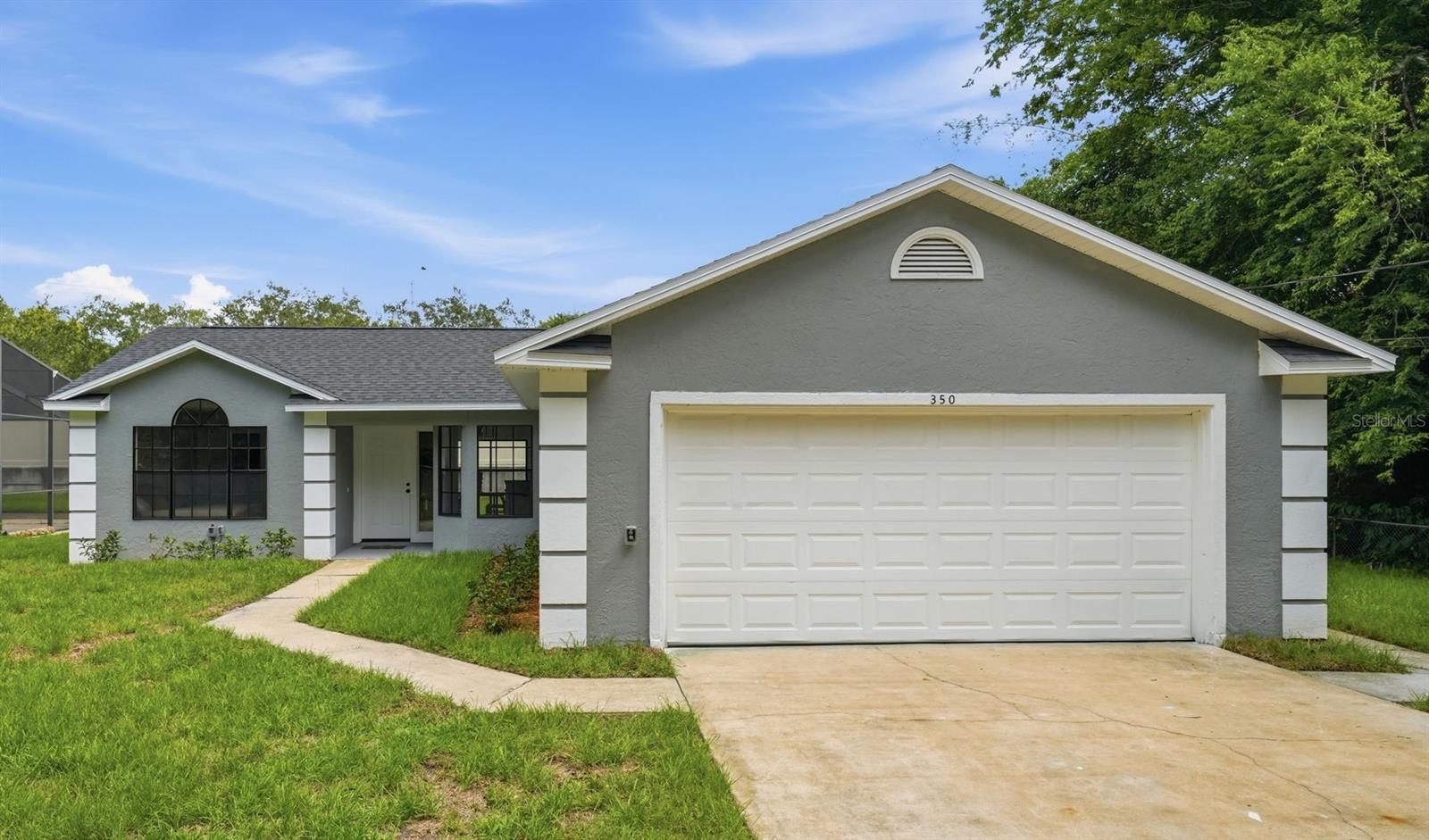 Gorgeously remodeled home in a desirable Debary Location with NO HOA! All NEW features were completed in 2026 and include: New Roof New HVAC, New Water Heater, & New Interior Finishes Including Flooring, Cabinets, Countertops, Doors & Trim, Appliances, Bathtub / Shower, Faucets & Fixtures etc. From the moment you enter this home, you will be greeted by soaring vaulted ceilings and durable, waterproof laminate flooring, and a beautiful kitchen featuring white shaker cabinetry, stainless steel appliances, and granite countertops! You'll appreciate the functional split floor plan, oversized 2 car garage, and generously sized primary suite with beautifully finished private bathroom and large walk-in closet.  Located within walking distance to a Spring to Spring trailhead and a commuter's dream with I4 onramps located just outside the neighborhood.