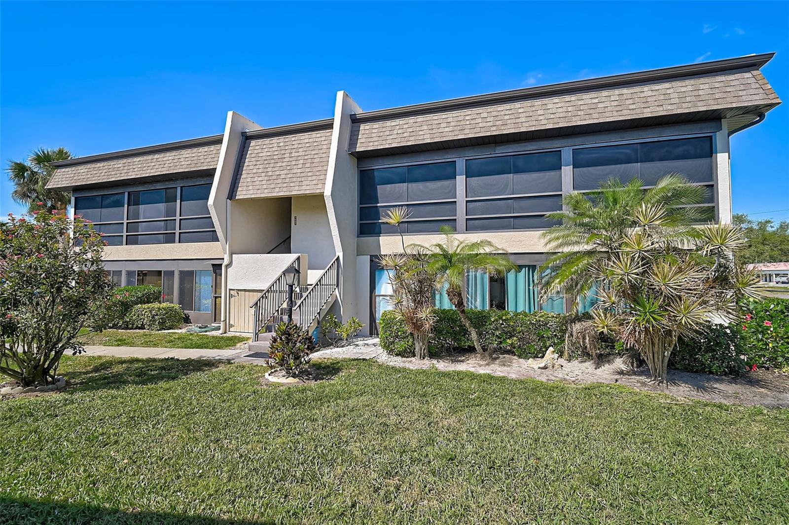 Welcome to Villa Nova, a beautifully maintained 55+ community tucked away in the heart of Venice. Known for its lush landscaping, friendly atmosphere, and convenient location, this community is just minutes to I-75, Gulf Coast beaches, historic Venice Avenue, and a variety of nearby dining and shopping options.  This move-in-ready condo offers bright, open-concept living with luxury vinyl plank flooring throughout and generous room sizes with ample closet and storage space. The stylish kitchen, updated in 2021, features wood cabinetry and granite countertops. The spacious primary suite includes a walk-in closet and an updated en-suite bath with a walk-in shower, while the guest bath has also been tastefully renovated for a cohesive, modern feel. Relax on the oversized screened lanai and enjoy peaceful sunrises and year-round breezes. Additional features include in-unit laundry and a new electric panel (2024). The building also has a new roof, and the condo fee was recently reduced, providing added value and peace of mind. Residents enjoy a well-appointed clubhouse with a heated pool, library, kitchen, and outdoor grill. Be sure to view the 3D walkthrough tour to fully experience this lovely home. Schedule your private showing today.