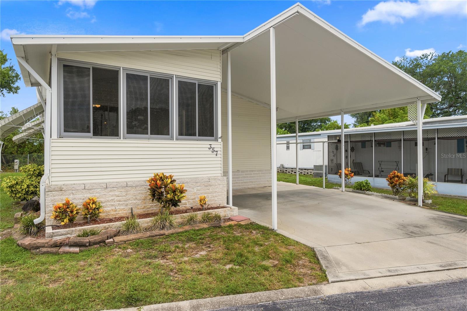 Welcome to this beautifully maintained, move-in ready 2-bedroom + office home located in a desirable resident-owned 55+ community. Built in 2005, this high and dry home requires no flood insurance and offers an open great room with vaulted ceilings that creates a bright, spacious atmosphere. The thoughtfully designed floor plan includes an indoor laundry closet, a private primary suite with an en-suite bath and walk-in closet, plus a versatile office that is perfect for working from home, hobbies, or accommodating guests.
Beyond the home, you'll enjoy an impressive array of resort-style amenities designed for an active and social lifestyle. Residents have access to two heated swimming pools, a large indoor hot tub, separate men's and women's saunas, a fully equipped fitness center, and a spacious clubhouse with seating for up to 150 guests and a full kitchen for community events. Additional amenities include a library with games, puzzles, and videos, billiards, poker and card rooms, table tennis, lighted shuffleboard and bocce ball courts with league play, horseshoe courts, a golf practice driving area, a park with an outdoor grilling area, two laundry facilities, and two drying yards. This welcoming community offers the perfect combination of comfort, convenience, recreation, and an active Florida lifestyle.