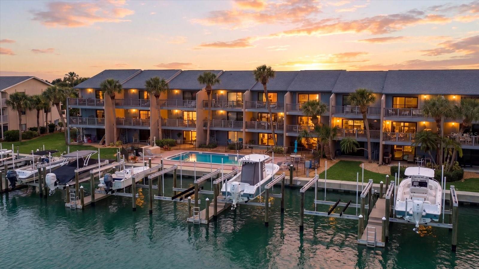 Located in Capri Landings on Treasure Island, this waterfront townhome is part of an eight-unit community with assigned boat slip and garage. Backyard access to sailboat water with a route to the Gulf via John’s Pass. A short walk to Gulf beach access. This home is beautifully maintained with so many upgrades and new furnishings, there is nothing left to do, simply move in and make it yours.

Fully furnished, 2 bedrooms, 2.5 baths with large bonus room. Second floor living features spacious updated kitchen with new Quartz countertops and SS appliances, wood-burning fireplace and waterfront balcony. Third floor bedrooms with newer carpeting, primary includes private balcony with landscape views of intercoastal waterways. Ground level patio with extensive green space and new gated backyard. One car garage, driveway and assigned parking. Waterfront pool, heater/chiller. Pet friendly. Considerable storage throughout. This well-managed building has successfully completed the Milestone Inspection. New roof, 2021 and seawall, 2020.

2026 new landscaping, sod and trees, and resealed lot. Adding new fencing to property and entire building repaint, already in reserve.

2025 new hurricane-rated windows, all sliding doors, plantation shutters, remote blinds / front door, remote lock / garage, new epoxy flooring / ground level, all new paint / bonus room with AC, remote ceiling fan and refrigerator (suitable for home office, fitness).

2024 new washer, dryer / tankless water heater / 2 new AC systems (Nest, smart thermostat) / fixtures, toilets. Waterfront improvements, new boat docks and Neptune lifts (approx. 13,000 lbs.).

Larger dogs permitted, a feature not commonly available. Property is located near Roselli Park, dog park and pickleball courts. Convenient access to waterfront dining, shopping and local amenities. Boat (2022 SeaHunt, 26ft center console) available for purchase under separate agreement.