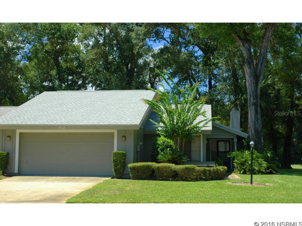 Outstanding location; quiet cul de sac; wooded lot on the golf course! New interior paint, new carpet throughout, new stainless dishwasher & refrigerator, new bronze rubbed copper hardware & new tile flooring in kitchen. Sunken living room features a wood burning fireplace & an awesome view of the 3rd fairway of the Spruce Creek golf course. Close to community pool, medical facilities, shopping & the World's Most Famous Beach.