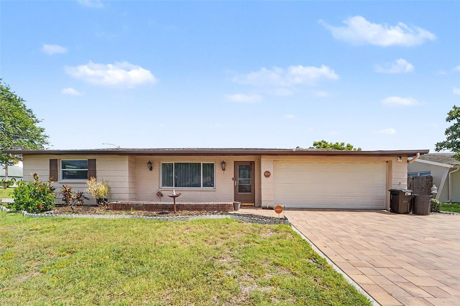 Nice sized 3 bedroom, 2 bath, 2 car garage pool home located on a fenced corner lot with a brick paver driveway. The interior features a bright and spacious living room, ideal for entertaining. The kitchen offers ample cabinetry and counter space, including a pass-through to the family room and an open layout that connects seamlessly to the dining area. The family room provides a comfortable living space with sliding glass doors that open directly to the patio and in-ground pool. The property utilizes a split-bedroom floor plan. The large master suite includes both a walk-in closet and a secondary closet, while the two additional bedrooms are generously oversized. Outdoor amenities include a large covered rear porch and a recently rescreened pool cage, perfect for outdoor gatherings. The sparkling in-ground pool features a newer pump motor. Additionally, this property requires no HOA fees or flood insurance and is conveniently located across from Dayspring Academy.