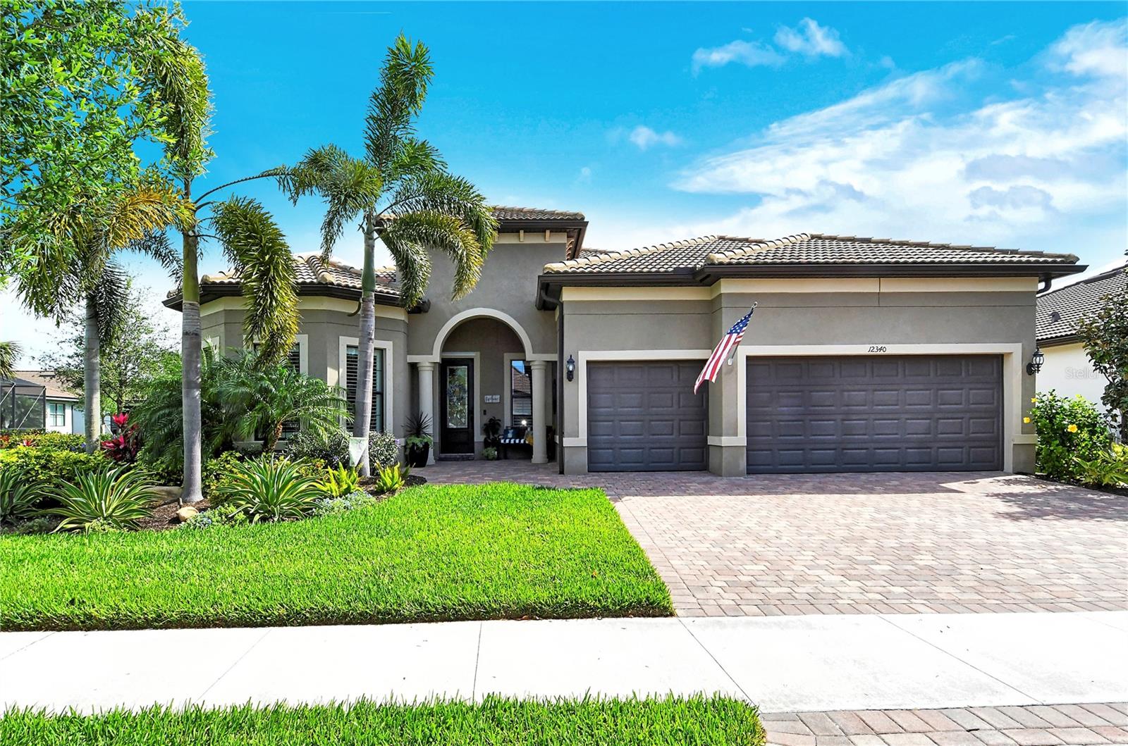 Come take a look and fall in love with this open concept, split-floor plan built by DIVOSTA Homes in the sought-after community of Hammock Preserve on Palmer Ranch. The PINNACLE model offers one floor living with 3 bedrooms, 3 baths, an office/den, and 3-car garage.  Greet the morning relaxing on your expansive lanai surrounded by privacy landscaping and graceful Royal Palms.  While lounging by the beautiful heated saltwater pool and spa, watch the colorful, vibrant glow of the sunrise reflecting off the lake as the lighted fountain cascades like raindrops on the surface.  Love to grill outside?  Enjoy the full outdoor kitchen with mini-fridge, sink and storage while being mesmerized by the electric floor to ceiling stone fireplace. Inside the home features 11 foot ceilings with 8’ interior doors. The stylish eat-in kitchen is ideal for preparing home-cooked meals, equipped with stainless steel appliances, quartz counters, a massive center island, and customized walk-in pantry complete with counters and electrical outlets.  The spacious great room/kitchen/dining area combo creates a warm and inviting atmosphere ideal for relaxation.  Unwind in style in the large master bedroom featuring an en-suite bathroom with large walk-in shower, dual sinks and spacious customized closet featuring built in cabinets, vanity with drawers, pull out hamper and even a jewelry drawer.  Upgrades galore in this home…plantation shutters, front entry paver extension, paver sidewalk from driveway to rear lanai, landscape lighting, water purification system, epoxy garage floor, remote hurricane lanai screen, just to name a few!  Transferable warranties include…Lenox Air Handler & Heat Pump, 5-yr Builder and 10-yr Structural.  Perfectly located within a gated, maintenance-free community, this is a lifestyle community offering tennis, pickle ball, a resort-style pool, bocce ball and a state of the art fitness room. Hang out at the Barefoot Bar or spend time in the clubhouse that offers a large gathering room and kitchen for the many events the community holds. It’s the perfect location near world famous Siesta Key Beach as well as Nokomis Beach, shopping, golf, restaurants, Legacy Bike Trail, & easy access to I-75. Schedule a showing today! Room Feature: Linen Closet In Bath (Primary Bathroom).