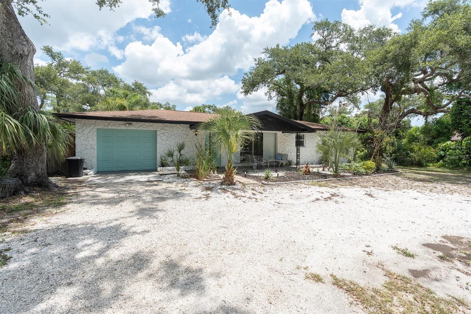 FULLY RENOVATED POOL HOME with NO RENTAL RESTRICTIONS offering the perfect blend of lifestyle and investment potential. This move-in ready 2 BEDROOM, 2 BATH home also features a FLEX/OFFICE that can easily function as a 3RD BEDROOM. Situated on an OVERSIZED LOT at the end of a QUIET DEAD-END STREET people rately move away from, you'll enjoy exceptional privacy surrounded by lush tropical landscaping. Recent updates include a NEW KITCHEN, RENOVATED BATHROOMS, NEW FLOORING, NEW HVAC DUCTWORK, MODERN LIGHTING, FRESH INTERIOR & EXTERIOR PAINT, EXPANDED C-SHAPED DRIVEWAY with room for multiple vehicles, RV and BOAT PARKING, PLUS ALL NEW WINDOWS and a NEWLY SCREENED LANAI completed in 2025. The sparkling pool creates your own private backyard retreat, while the property's SUCCESSFUL SHORT-TERM RENTAL HISTORY and NO RENTAL RESTRICTIONS provide incredible flexibility for personal use or income generation. Centrally located just 5 MINUTES TO MADEIRA BEACH, 20 MINUTES TO DOWNTOWN ST. PETERSBURG, 30 MINUTES TO CLEARWATER, and approximately 30 MINUTES TO BOTH TAMPA (TPA) and PIE (ST. PETE/CLW) AIRPORTS. Quick 5 Min Drive to SEminole City Center for Movies, Dining, and Shopping for guests and easy straight shot to the Beach.This one isn't just style, it's THE Florida Lifestyle — Priced to Sell Quickly. Schedule your private showing today!