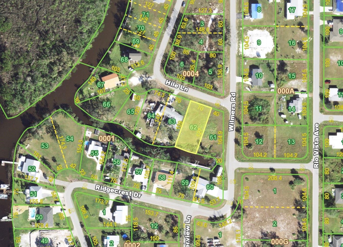 Waterfront Lot situated in the boating community of Peace River Shores. Located just off of hwy 17 and minutes away from the Punta Gorda Airport and I-75. This vacant lot is cleared and ready for buyers to build on. Boating enthusiasts will love that it sits on a canal with direct water access to the Peace River, Charlotte Harbor and the Gulf. Looking for even more land? The adjacent corner lot is also available for sale- giving you the rare potential to create a sprawling double corner waterfront estate (411 Hile Lane).

Peace River Shores is a non-deeded restricted community with an Optional HOA which private owners can join and get access to the neighborhood boat ramp and clubhouse, allowing flexibility rarely found in waterfront neighborhoods. Conveniently located near Punta Gorda's charming historic downtown, Fishermen's Village, top-rated restaurants, and excellent fishing, yet tucked away enough to preserve a private, laid-back coastal feel. Whether you’re an avid fisherman, cruiser, or waterfront enthusiast, this property delivers storage, access, and lifestyle—all with exceptionally quick time to open water. Don't miss this opportunity to secure your slice of waterfront Florida living!