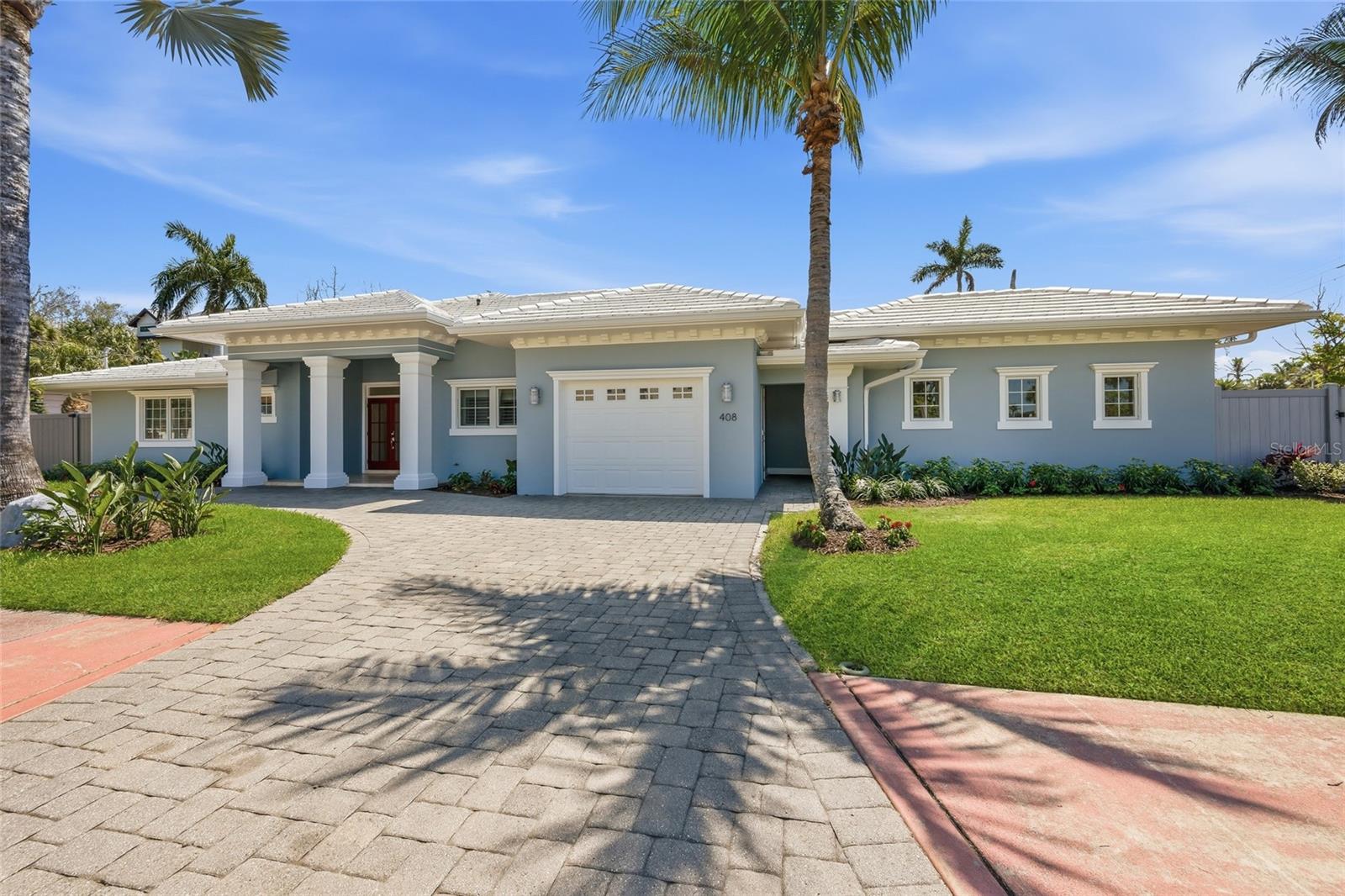 Under contract-accepting backup offers. Better than new and upgraded to perfection! Steps from St. Armands Circle, this spacious and quiet 4BR/4BA home offers tranquility in its simplicity, while still walkable to a bevy of options for activities and entertainment. The fenced-in garden, pool, and covered outdoor eating area make this nearly new home a gem of all jewels. Walk to St Armands Circle in minutes, a short distance to Lido Beach, and Sarasota’s bustling downtown. Perfect for family living or entertaining on any scale. Nothing was overlooked when this home was meticulously renovated recently! Remarkable touches and style are visible in every room, from soaring tray ceilings and recessed lighting, to the seamless indoor/outdoor flow that’s created by a wall of double-paned sliders, and a shady poolside outdoor eating/grilling space. 
The open and light-filled Great Room effortlessly connects to a welcoming dining area and exquisite new chef’s kitchen, boasting waterfall quartz countertops and backsplash, as well as an extended breakfast bar, SS appliances, convenient pot-filler, and updated neutral sage-tone solid wood cabinets on display. The Casita with a separate (keyless) entryway would delight any overnight visitors! This private suite boasts its own mini-kitchen, bathroom, walk-in closet, and French doors leading guests directly into a hidden and relaxing pool area. Just 2 blocks to St. Armands Circle, minutes from the heart of downtown Sarasota and its Bayfront, where a sprawling cultural hub offers: theaters, Opera, museums, restaurants, boutique shopping, dining, and plenty of entertainment venues. Finally a place where you can relish in the peace and luxury of quiet comfort near St Armands Circle, while enjoying the best entertainment and activities that downtown Sarasota can share. Come see it for yourself!