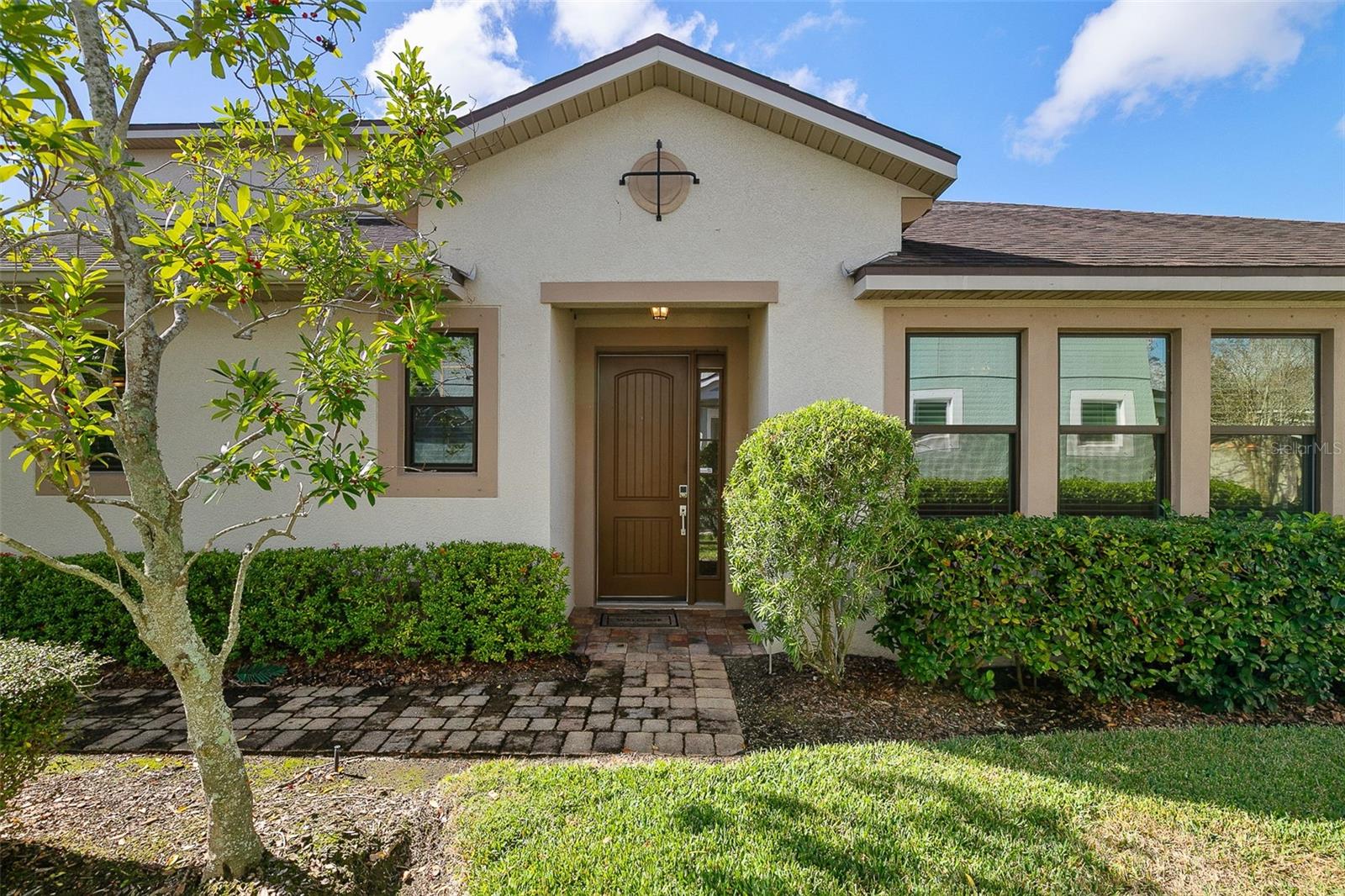 One or more photo(s) has been virtually staged. Major price reduction! This classic 3 bedroom, 3 bath, 2-story rarely listed end unit town-home is located in the highly sought-after community of Harmony at Lakewood Ranch. Perfectly situated south of SR 64 and other major roadways. Located near the Lake Erie College of Osteopathic Medicine and Denistry (LECOM). This prime location offers you an easy commute and quick access to a variety of shops, dining options, top-rated schools, scenic Waterside and much more. The home boasts a bright and spacious open floor plan, featuring beautiful wood laminate and tile flooring throughout, complemented by a convenient 2-car garage. The kitchen seamlessly flows into the great room and is equipped with a full range of modern appliances, elegant quartz countertops, a generous pantry, and a large island with a breakfast bar—ideal for casual dining and entertaining. Adjacent to the kitchen is a cozy breakfast area with a sliding glass door that opens to a large screened-in lanai, perfect for relaxing or hosting outdoor gatherings. The spacious main bedroom offers a tray ceiling, a large walk-in closet, and a luxurious en suite bath with dual sinks, a walk-in shower, a large soaking tub, and ample storage space. The second bedroom is also generously sized with excellent closet space and share a well-appointed bathroom. Additionally, there is a versatile en-suite loft area that can serve as a 3rd Bedroom, extra family room, a home office, or a playroom to suit your lifestyle needs.  It also has a much sought after "walk in Florida Attic". The community itself provides a wealth of amenities, including a resort-style pool, a clubhouse, a fully equipped fitness center, and a playground. This amenities center is a stone's throw away!  Don’t miss the opportunity to own this stunning home in such an exciting and vibrant community, schedule your tour today!