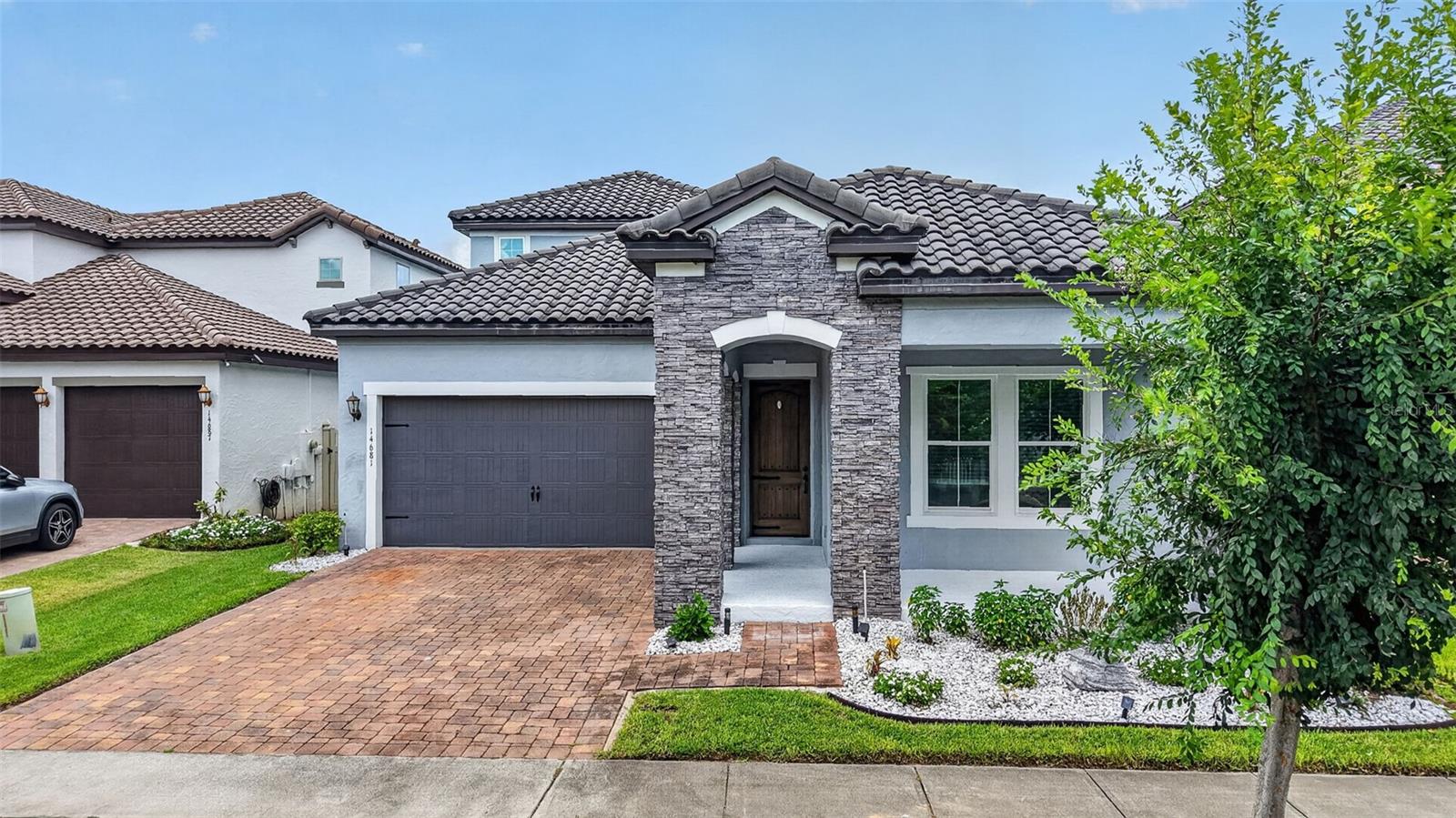 WELCOME HOME to this spacious 3 bedroom / 2 full & 2 half bathroom property, located in the desirable Horizon West area of Winter Garden. Conveniently located within the Watermark community, just one mile east of the 429 and a short drive to all major theme parks, shopping and dining. Built in 2016 by Meritage Homes, this Alcott model offers over 2500sqft with a large bonus room / half bath as well as an oversized living room. Expansive backyard that contains a covered outdoor space, complete with summer kitchen and hot tub, under warranty until Feb/2027. Step into the fully fenced backyard onto the private putting green with tropical landscaping. SunPower 2KW 6-Panel solar system that is owned outright. Large 2-car garage with sealed floor, overhead storage and 50 Amp Heavy Duty EV Charging Port. Original owner who has meticulously cared for this low maintenance and energy efficient property. A/C unit replaced in Sept/2024 with 10 Year warranty. Screen enclosure structure and roof under 10 Year warranty. This property is a move-in ready gem, and will not last long. Schedule your showing today!