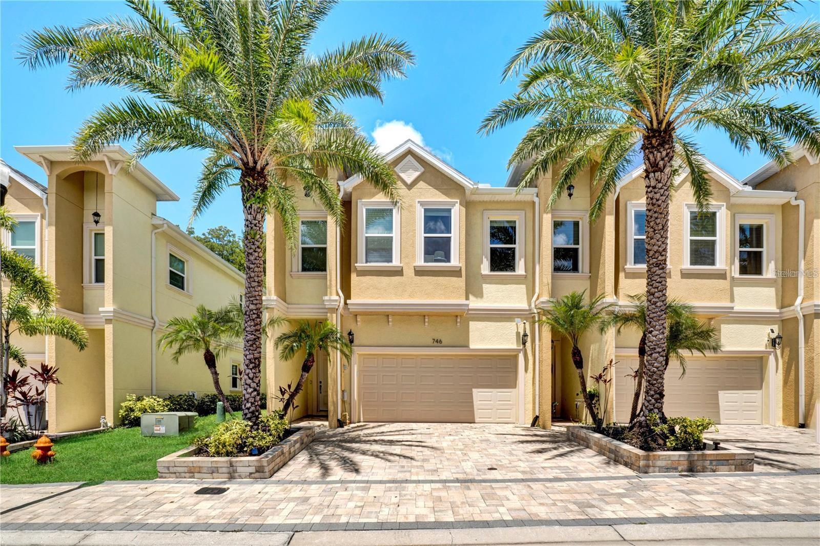 Low-Maintenance Luxury Meets Active Florida Living. Forget the weekend yard work and embrace the ultimate Florida lifestyle. Nestled in the highly sought-after Grand Cypress Trails community, this premium 3-bedroom, 2.5-bathroom end-unit townhouse offers the perfect blend of modern luxury, privacy, and convenience. Built in 2022 and completely move-in ready, this home is designed for those who want a sophisticated, "lock-and-leave" lifestyle just minutes from world-class golf courses, pristine beaches, the Pinellas Trail, and historic downtown Tarpon Springs.

From the paver driveway and covered entryway to the soaring ceilings inside, every detail of this home exudes quality. The main floor features an airy, open-concept layout grounded by luxury vinyl plank flooring. Whether you are hosting an intimate dinner in the elegant dining area or relaxing in the massive great room, the space flows effortlessly.

Elegant plantation shutters dress the windows, while the impact-resistant sliders open up to a private, screened-in lanai. Complete with a privacy shade and a dedicated grilling area, it’s the ultimate spot to enjoy peaceful preserve views.

Upstairs, the expansive primary suite serves as your personal oasis. Step out onto your private balcony to sip morning coffee or watch the sunset over the preserve. The spa-like en-suite bathroom boasts granite dual vanities with upgraded mirrors, and expansive walk-in shower and a large custom walk-in closet. Live the life you’ve earned. No mowing, no hassle—just luxury, nature, and immediate access to the best of Tarpon Springs. Schedule your private tour today!
