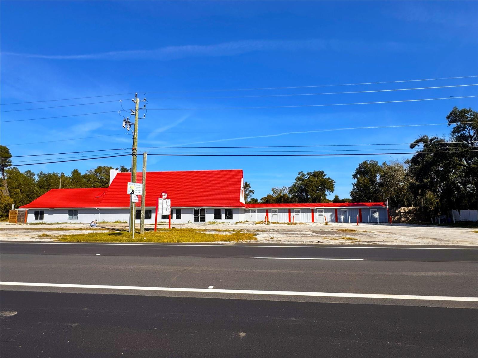 One or more photo(s) has been virtually staged. Great investment opportunity to acquire a corner parcel with over 245 feet of frontage on U.S. Highway 1 at the intersection of Aurantia Road. This 1.18-acre property features three separate buildings totaling 6,013 square feet, with multiple access points for flexible use. The property is zoned BU-1, allowing commercial retail along the frontage and four residential units with two-car garages to the rear and opportunity to generate multiple income sources. Enhanced by excellent visibility, strong curb appeal, and convenient access to I-95, this property is ideally located within the growing Space Coast corridor, near Titusville and Melbourne. Owner financing available with $200,000 down, offering an attractive opportunity for investors or owner-users.