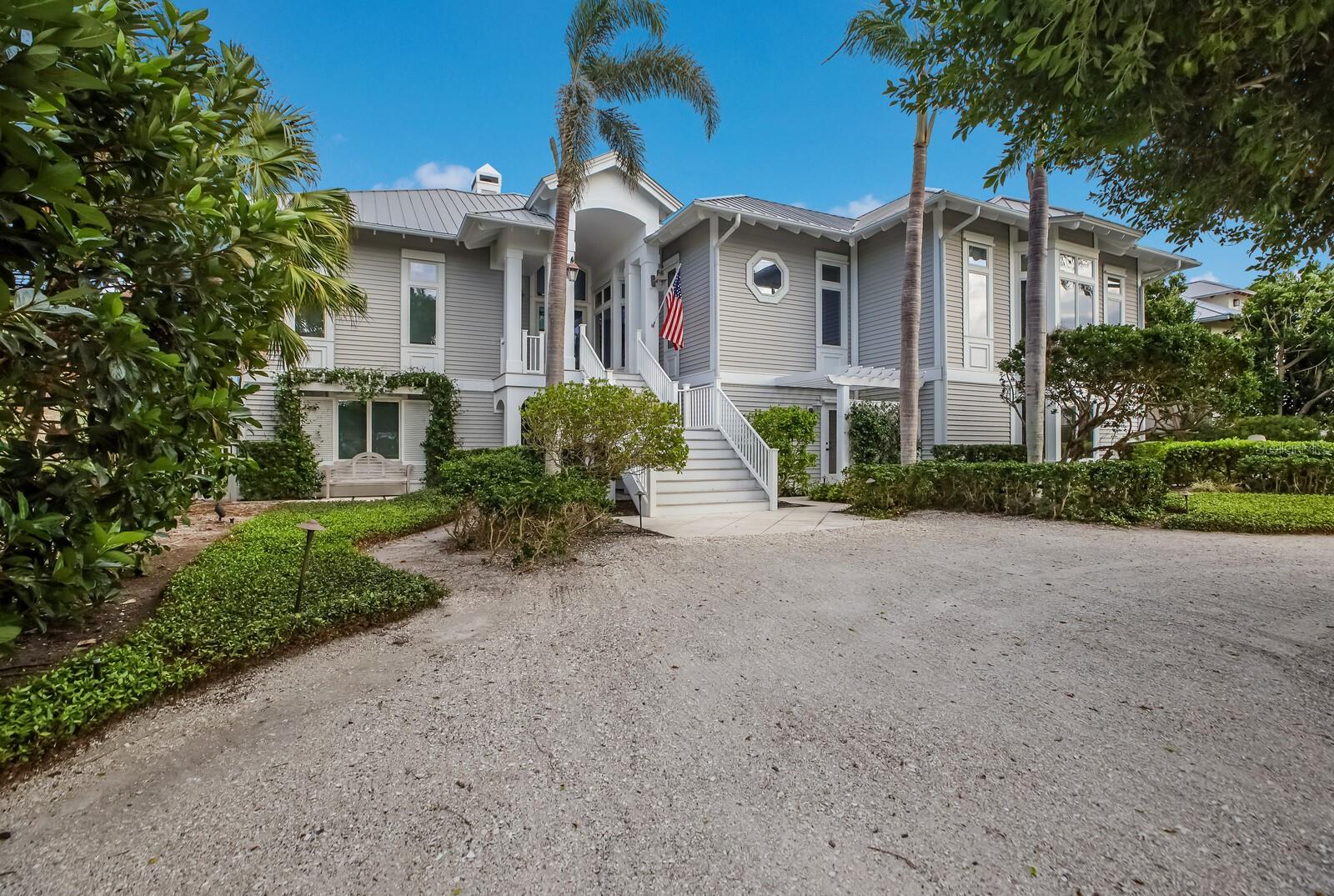 Located in the gated community of Boca Grande Isles is an impressive 6 bedroom, 6.5 bath waterfront residence with 5,812 square feet of living area.  Built in 2001, this stunning home is nicely positioned, amidst mature landscaping, along 100’ of rip rap shoreline providing sweeping vistas of Charlotte Harbor.  

Attention to details is found in the intricate custom crown molding and trim throughout, 6” base boards, hardwood walnut flooring and travertine tile, custom high ceilings, wains coating walls and a gas fireplace with a beautiful floor-to-ceiling coral stone wall adding depth and extra warmth to further enhance each room. 

The extensive living area boasts a cathedral custom wood millwork ceiling, built-in cabinetry, a full wet bar equipped with a wine cooler, and a wall of sliding glass doors accessing a wrap-around enclosed lanai to maximize the spectacular waterfront setting. 

Each of the six bedrooms are thoughtfully designed with comfort and privacy, offering en-suite baths and ample closet space. 

The custom well-designed kitchen features a 6-burner Thermador gas stove, Sub Zero and Bosch appliances, double stainless-steel sinks and a large center island adjacent to a turret style breakfast area with plantation shutters.   

The main floor expansive owner’s suite offers custom designed high ceiling, oversized dual walk-in closets outfitted with custom built-ins, a soaking tub, walk in shower, large vanity with dual sinks, and access to the enclosed wrap around lanai. An extra construction feature is ½ inch steel rods every 4-5 feet from the footings to the roof for added support. Additionally, the main floor offers a home office, laundry room, powder room, and a guest en-suite.  

The lower level offers a spacious living area, home office with custom cabinetry, three ensuite bedrooms, with access to the pool/spa.  Additional features include an elevator, 2 car garage with golf cart parking, 3 AC systems, 2 HEPA filters and security system. 

Outside, a circular driveway, pool/spa, and mature tropical landscaping encloses the grounds for privacy.