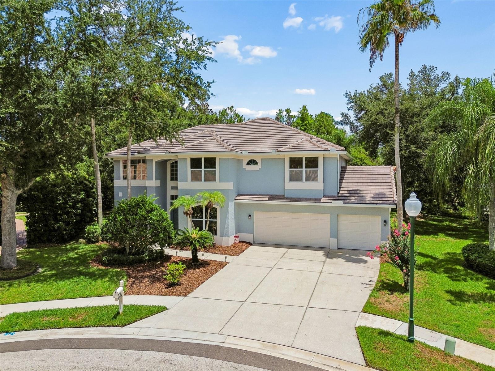 Luxury, privacy, and timeless style come together in this beautifully updated home nestled on one of Arbor Greene's most desirable cul-de-sac homesites. Situated on an oversized pie-shaped lot of nearly a quarter acre, this exceptional property is surrounded by lush, mature landscaping and conservation, creating a peaceful backyard retreat with remarkable privacy. Step inside and be greeted by a stunning double staircase that anchors the grand two-story foyer, making an unforgettable first impression. The thoughtfully designed floor plan offers 4 spacious bedrooms, a dedicated downstairs office perfect for working from home, an enclosed upstairs bonus room and a 3-car garage. At the heart of the home is a completely remodeled kitchen (2023) featuring crisp whte shaker cabinetry, beautiful quartzite countertops, a farmhouse sink, stainless steel appliances, and an oversized island that opens seamlessly to the main living areas—perfect for everyday living and entertaining alike. New triple sliding glass doors (2022) flood the home with natural light while creating a seamless transition to your outdoor oasis. Step outside to your private screened lanai where a sparkling pool and heated spa are surrounded by mature trees and tranquil conservation views. Whether you're hosting family gatherings or enjoying a quiet evening at home, this backyard offers the privacy and serenity that's becoming increasingly difficult to find. Additional upgrades include new laminate flooring throughout (2023), brand new tile roof (2026), and countless modern finishes that make this home completely move-in ready. Located within the renowned gated community of Arbor Greene, residents enjoy resort-style amenities including a beautifully appointed clubhouse, multiple swimming pools, tennis courts, fitness center, playgrounds, and scenic walking trails. Conveniently located near top-rated schools, shopping, dining, hospitals, USF, Tampa Premium Outlets, and major highways, this home truly offers the best of New Tampa living. Beautifully updated, impeccably maintained, and set on one of the community's most private homesites, this is a rare opportunity to own a home that checks every box. Call John or Pauline for your private showing today.