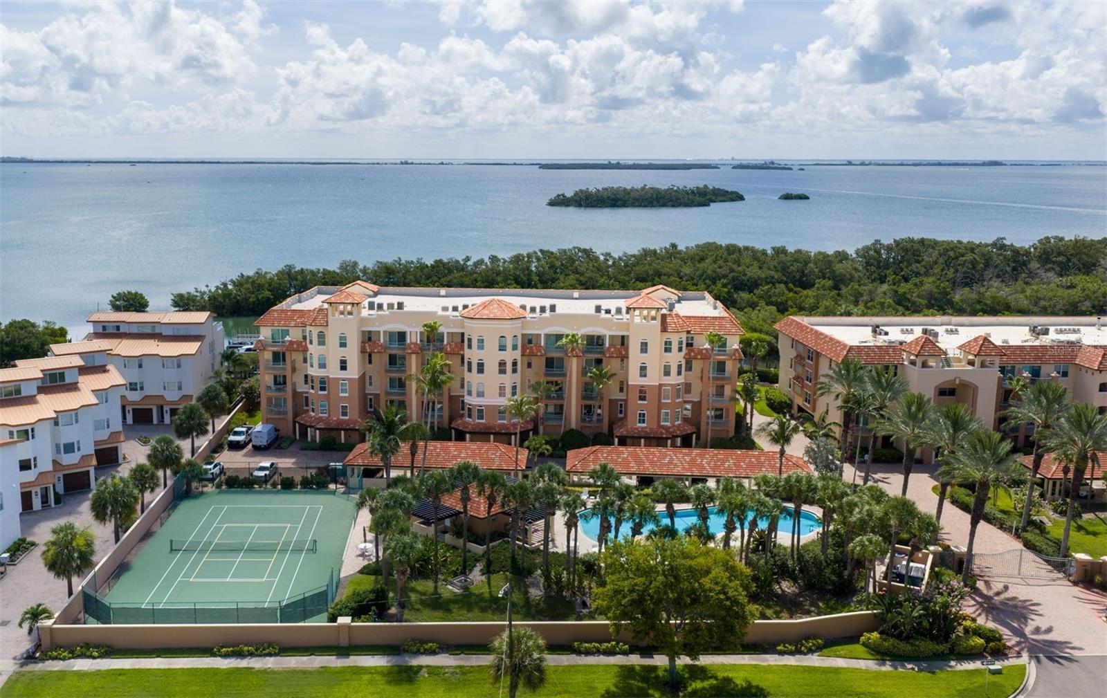 Welcome to Hidden Lagoon, a premier waterfront community in the prestigious island enclave of Tierra Verde. This exceptional 3-bedroom, 3-bathroom residence offers the perfect blend of luxury, comfort, and boating lifestyle. Step off the elevator into your private foyer entrance and discover a thoughtfully designed floor plan featuring two spacious primary suites, each with its own ensuite bathroom, a third bedroom with additional office space ideal for remote work or hobbies. The beautifully updated kitchen showcases solid wood cabinetry, modern granite countertops, a center island with raised breakfast bar seating for four, a premium GE appliance package, cabinet-paneled refrigerator, Bosch dishwasher, and wine cooler, perfect for entertaining family and friends. Throughout the home, you'll find quality finishes including stone countertops in the bathrooms and hurricane-rated impact-resistant windows and sliding glass doors for added safety and peace of mind. Relax on your private waterfront balcony and enjoy serene views, or take advantage of the included boat slip equipped with a 16,000-pound lift, providing direct access to some of Florida's finest boating waters. Additional highlights include a 2018 HVAC system and water heater, as well as a 2019 roof. Hidden Lagoon offers an impressive collection of resort-style amenities, including two large swimming pools (one heated), a heated spa, poolside bathhouses with showers, tennis and pickleball courts, BBQ grilling areas, a fitness center, waterfront docks, fishing piers, EV charging stations, and additional boat slips available for rent through the HOA. Living in Tierra Verde means embracing an unmatched coastal lifestyle with easy access to Fort De Soto Park, Shell Key Preserve, and Pass-a-Grille Beach. Enjoy nearby waterfront dining, world-class boating and fishing, and all the entertainment, shopping, dining, and nightlife of downtown St. Petersburg. Tampa International Airport is conveniently located approximately 30-45 minutes away. Experience the best of waterfront living in one of Tierra Verde's most desirable communities. Schedule your private showing today!