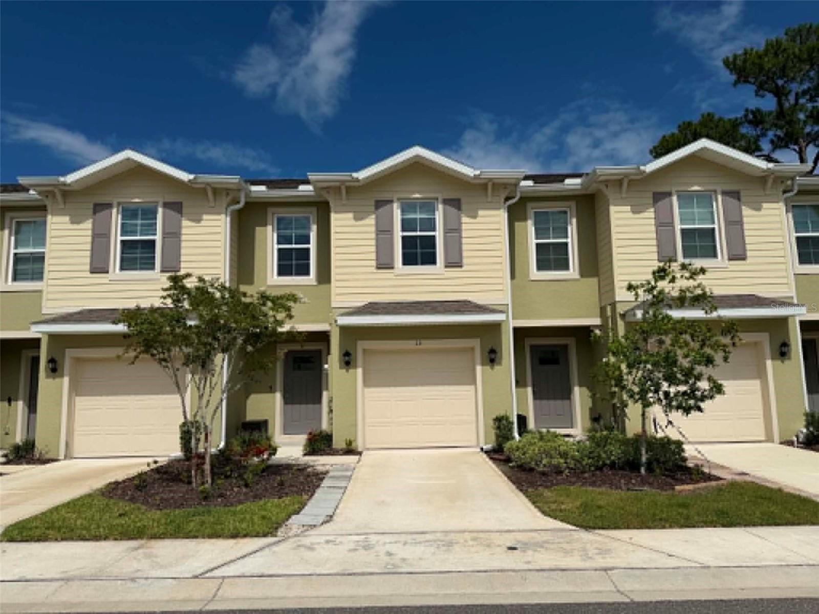 Virtually Staged. Built in 2023, this concrete block townhome offers 3 bedrooms, 2.5 bathrooms, and a functional two-story layout in a convenient Port Orange location. The first floor includes a foyer entry, half bathroom, open family room, dining area, and kitchen. The kitchen features a large granite island, stainless steel appliances, granite countertops, and a pantry. The family room opens to a lanai/private back patio with a green space view. All bedrooms are located upstairs. The primary bedroom includes two windows, a walk-in closet, and a private bathroom with a double-sink granite vanity and spacious shower. Two additional bedrooms share a full bathroom with granite countertops. Additional features include a nearly new washer and dryer, stainless steel appliances, granite surfaces, and a layout designed for practical everyday living.
The community offers a waterfront gazebo, playground, and scenic walking path. Centrally located in Port Orange near Williamson Blvd and Dunlawton Ave, with convenient access to I-95, The Pavilion at Port Orange, shopping, dining, medical facilities, Daytona Beach International Airport, local universities, and nearby beaches.