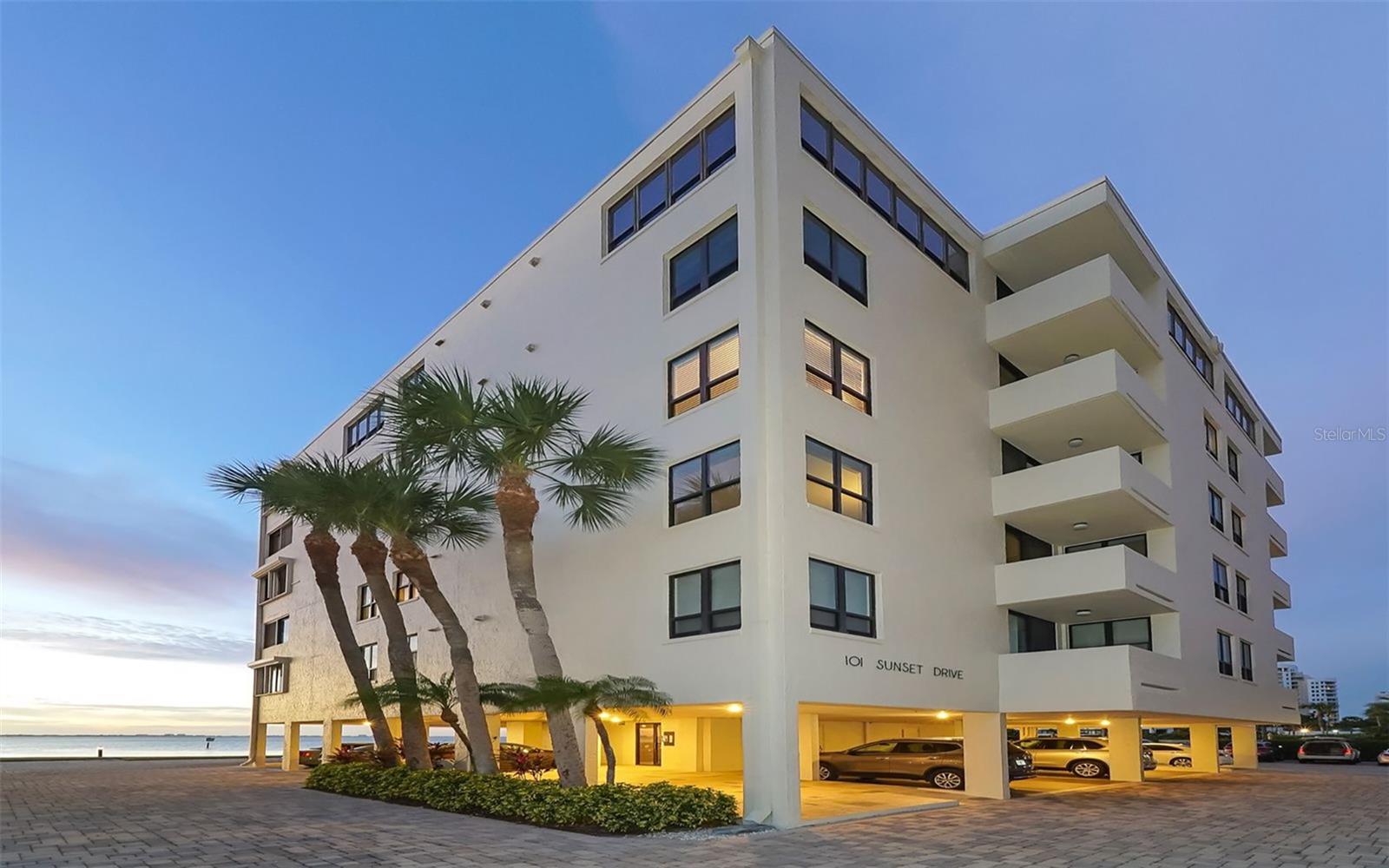 Live every day as if aboard a private yacht with sweeping, unobstructed panoramic views placing you directly above the sparkling waters of Sarasota Bay. This exceptional two-bedroom, two-bath, third-floor corner residence in the sought-after Lawrence Point community immerses you in the rhythm of the bay, from graceful sailboats and sleek yachts to playful dolphins and soaring seabirds, a living symphony of coastal life.  Meticulously renovated and designed to capture every ounce of natural light, this contemporary home blends modern sophistication with relaxed waterfront living. The terrace has been thoughtfully enclosed, adding nearly 200 square feet of versatile living space while two additional private balconies offer serene retreats to savor Sarasota’s signature sunsets and gentle bay breezes.  Inside, imported Italian porcelain tile flows throughout an open, light-filled layout complemented by contemporary recessed lighting and designer finishes. The gourmet kitchen is a showcase of Italian cabinetry, quartz countertops, and a stone tile backsplash, combining elegant style with abundant storage and functionality. The primary suite provides a peaceful sanctuary with its own private balcony and ample room for a sitting area. The second bedroom offers flexible options complete with a Murphy bed and built-in desk, ideal for guests, a home office, or a creative retreat. Custom built-ins and generous closets throughout ensure impeccable organization and effortless living.  Lawrence Point is an intimate, gated bayfront enclave renowned for its tranquil setting and some of downtown Sarasota’s lowest condominium fees. Residents enjoy a heated bayfront pool, meticulously landscaped grounds, on-site management, and a prime location just moments from the cultural heart of Sarasota, the weekend Farmers Market, and the scenic John Ringling Bridge leading to St. Armands Circle and Lido Beach. Covered under-building parking adds daily convenience steps from your door.  This is a rare opportunity to own a refined waterfront residence where spectacular views, elegant design, and the effortless Sarasota lifestyle converge.