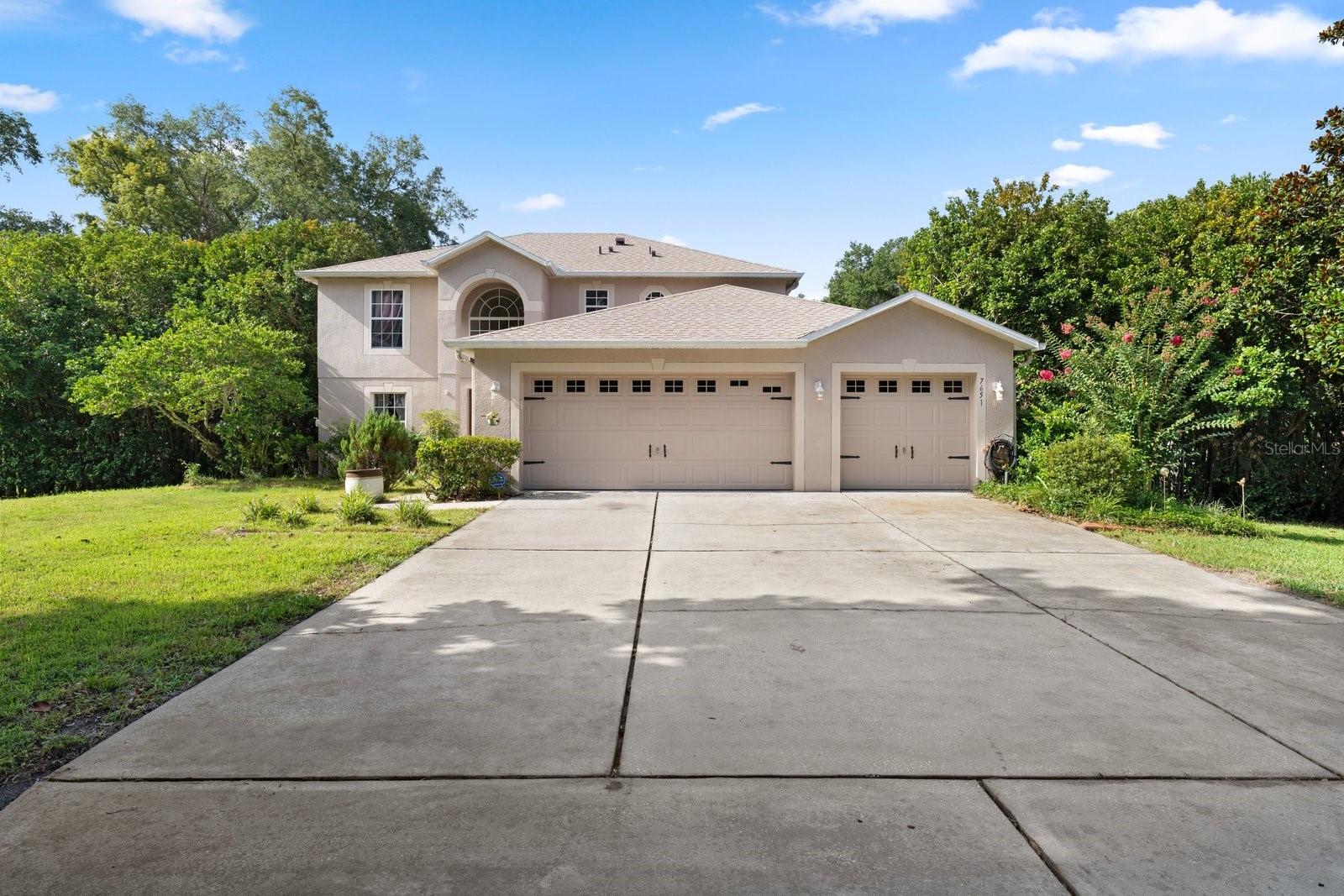 Rare Mount Dora Oasis: 1 Acre, No HOA, & Unlimited Space!
Discover the ultimate blend of freedom, luxury, and location. Nestled on a rare 1-acre homesite with a coveted Mount Dora address and no mandatory HOA, this elevated estate offers unparalleled space and privacy. Perfect for hobbyists and collectors, the property boasts total parking for seven cars plus an RV, featuring a detached garage and an additional workshop/shed. A brand-new roof (2026) ensures total peace of mind.
Inside, the open layout features 4 bedrooms, 2.5 bathrooms, and a massive first-floor office easily converted into a second primary suite. The chef’s kitchen shines with solid wood cabinetry, granite countertops, a center island, and a cozy eating space. Escape to the main primary retreat, complete with dual walk-in closets and a spa-like ensuite featuring a huge walk-in shower, garden tub, and dual sinks.  All flooring in this home are Solid Surface, no carpet.
Entertaining is effortless with a large rear lanai hosting an outdoor kitchen, plus a second side lanai. Both overlook a vast, beautifully treed yard. Located just minutes from historic downtown Mount Dora’s premier shopping, dining, and festivals, this property is a truly unique find!