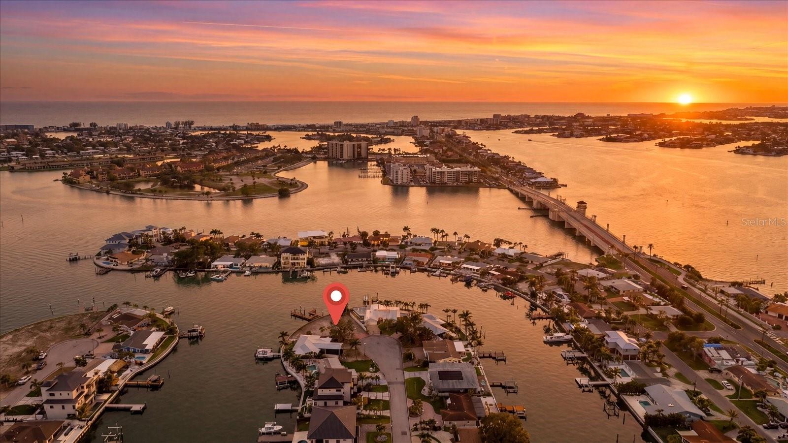150 FEET OF WATERFRONT READY FOR YOU TO BUILD YOUR DREAM HOME! Exceptional waterfront opportunity with 150 feet of frontage at the end of a quiet cul-de-sac, offering sweeping views up the canal, direct sight lines to the Intracoastal Waterway, and incredible sunsets. With no fixed bridges and multiple routes to quickly reach the Gulf of Mexico, this is a boater’s paradise. This is a premium location and rare opportunity to buy a point lot on the west side of Causeway Isles. No going around the island to get to the Gulf, means fast and easy access for boaters. No bridge delays—whether arriving by road or water. The 9,888 sq ft lot provides ample space to build your dream home complete with a pool, while enjoying privacy and incredible water access. Ideally located just minutes to the sandy shores of Treasure Island and a short drive to vibrant downtown St. Petersburg with its acclaimed restaurants, music venues, art museums, and galleries. You will love this location!