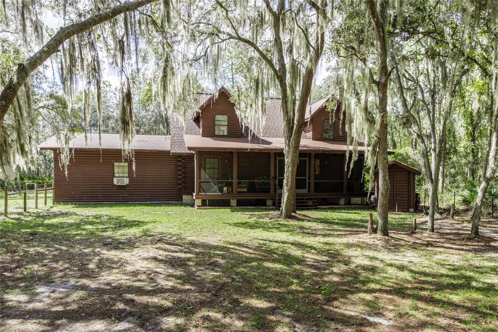 ***PRICE REDUCED!!!*** Escape to your very own lakeside retreat on 1.17acres, and approx 100 feet of lakefront! Come see this cozy log cabin on Riley Lake that offers the perfect blend of rustic character and modern comfort. Nestled between the trees, you can sit on the back porch and take in the stunning lake views and enjoy the soothing sounds of nature. Take a short walk to the dock and sit on the bench, and enjoy the soft wind and the sound of the water ripple below. This log cabin has wood from floor to ceiling, with real wood floors, and a large stone fireplace with an open-concept living area. The master bedroom is on the second floor, with a spacious sitting area that would be a perfect area for relaxing or reading a book. This bedroom also has a cozy bathroom for privacy. The second bedroom is downstairs and is also spacious enough for a large bed or multiple beds. The living room is right out of a story book with a large, one of a kind, fireplace. Sit by the fire to enjoy the sound of the fire crackling while wrapped up in a blanket. A separate building on the property is a finished studio/in-law suite. Whether you're seeking a full-time residence, a weekend getaway, or a short-term rental investment, this property delivers the ultimate cabin on the lake lifestyle. Don't forget to bring your boat, kayaks, fishing gear and enjoy what 42 acre Riley Lake has to offer. Call me for your showing today!