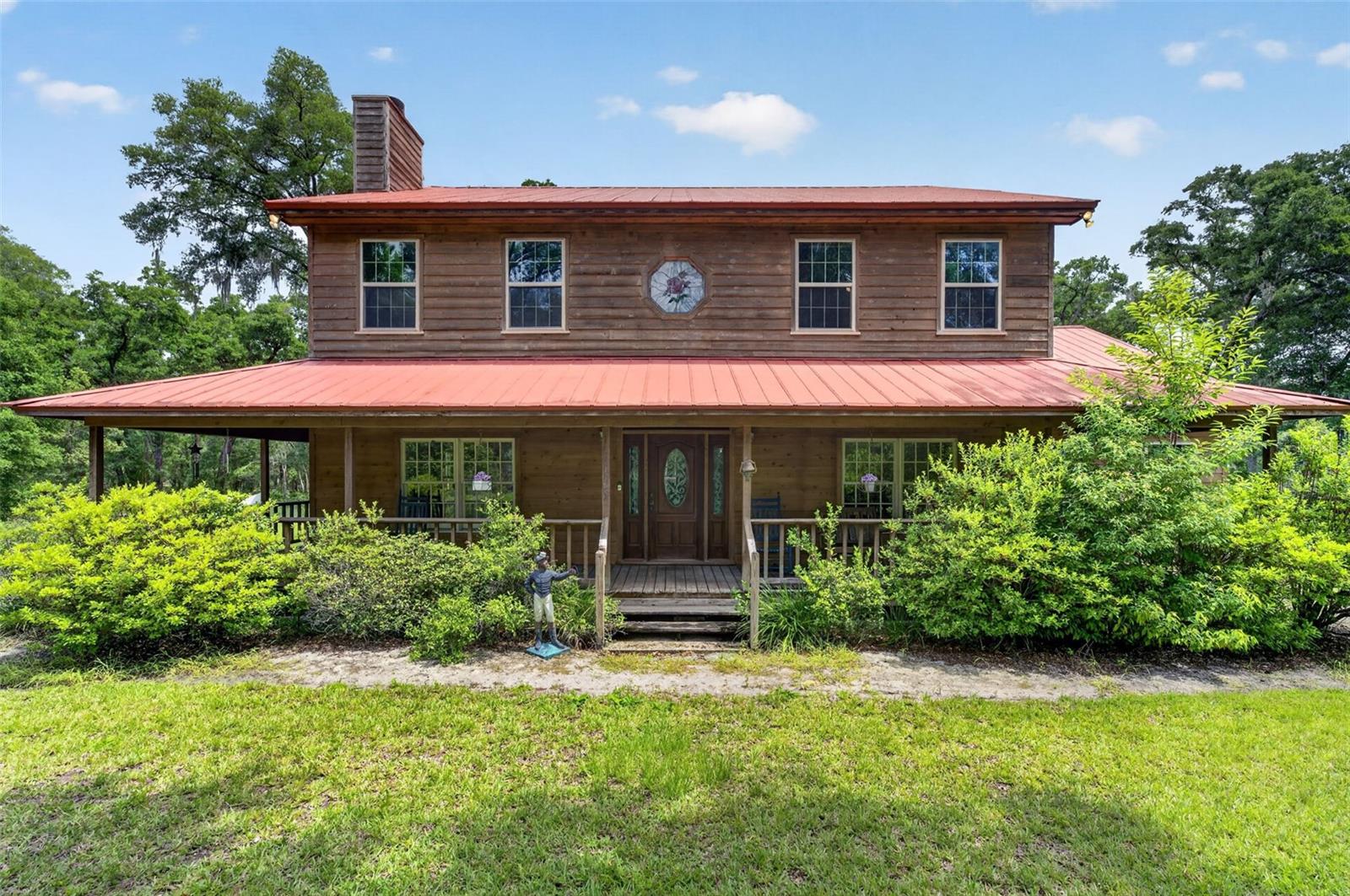 Nestled on just over 5 acres of beautiful land, this charming 1990 wood-frame home offers the perfect blend of privacy, nature, and comfort. Surrounded by mature trees and open space, it's an ideal retreat for those who appreciate peaceful woodland views and fresh country air. The home's expansive, nearly wraparound design invites you to relax and enjoy the outdoors, whether you're sipping your morning coffee or reading a favorite book on the spacious screened rear porch. 

Thoughtfully designed with family living in mind, this well-maintained home has been lovingly owned by the same family since it was built. The open floor plan creates a warm and welcoming atmosphere, while the loft overlooking the living room provides a unique vantage point and a sense of connection throughout the home. This is a rare opportunity to own a property that combines character, space, and a true sense of home.
