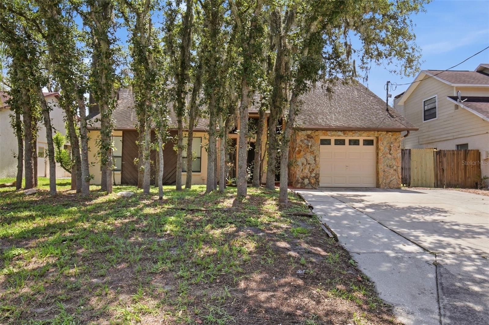 Virtually Staged. Located in a convenient Tampa area, this home presents a solid opportunity for buyers seeking a property with potential. The interior and exterior will benefit from updates and improvements, making it ideal for those looking to customize or renovate to their own taste. The layout offers functional living space, and the lot provides room for outdoor use or future enhancements. Conveniently situated near major roadways, shopping, dining, and schools, the location adds strong long-term value for the right buyer or investor.