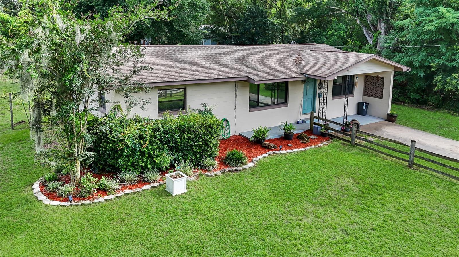 One or more photo(s) has been virtually staged. Charming Northeast Ocala home situated on a spacious lot with mature trees and plenty of room to enjoy the outdoors. This 3-bedroom, 1-bath residence features beautiful hardwood flooring in the main living area, a functional open layout, and abundant natural light throughout. The kitchen offers stainless steel appliances, ample cabinet space, and a convenient pantry.  Enjoy peaceful mornings or evening gatherings in the large backyard with room for pets, play, gardening, or future additions. Conveniently located near downtown Ocala, schools, shopping, dining, medical facilities, and major roadways.