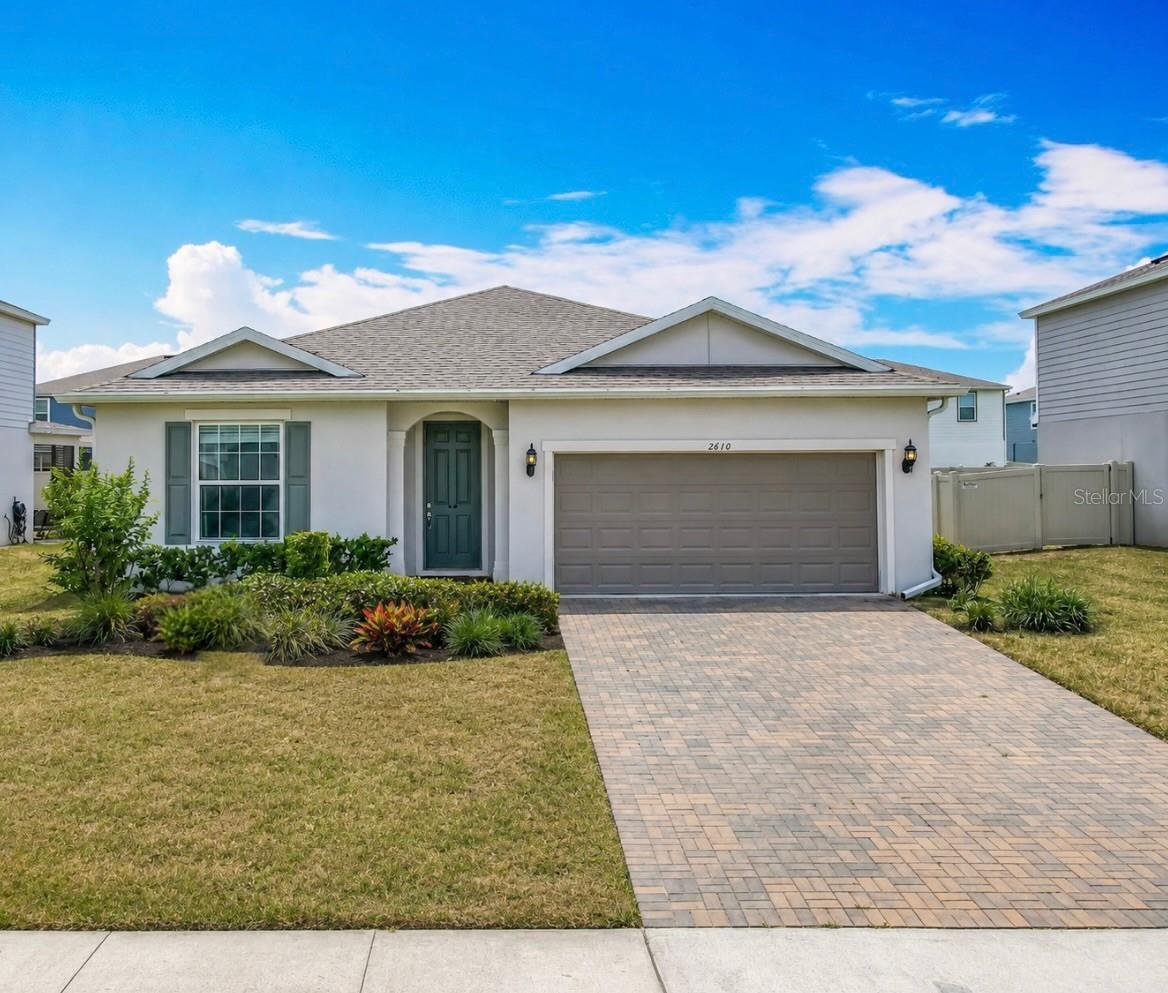 Welcome to Vista Reserve, where comfort, style, and functionality come together in this beautifully maintained 3-bedroom, 2.5-bath home with a dedicated office/flex space in the heart of Apopka. Don't wait to build, move right into the 5-year new Pulte home with builder warranty!

From the moment you step inside, you'll appreciate the inviting entry hall and thoughtfully designed open-concept floor plan. Just off the foyer, a spacious office or flex room overlooks the front garden and is tucked away from the main living areas, providing the privacy and quiet needed for working from home, studying, or pursuing hobbies.

The entry hall opens into an expansive kitchen, dining, and great room combination that is ideal for entertaining and everyday living. The chef-inspired kitchen features 42-inch wood cabinetry, granite countertops, a large walk-in pantry, stainless steel appliances, and a premium LG ThinQ refrigerator. A massive 7' x 3.5' center island with overhead pendant lighting  offers abundant prep space, seating, and gathering room for family and guests alike.

Adjacent to the kitchen, the generous 20' x 9' dining area easily accommodates large gatherings, while the spacious great room with tray ceiling creates a seamless flow for conversation and entertaining. Throughout the main living areas, gorgeous Ripped Pine luxury vinyl plank flooring complements any décor, with comfortable carpeting in the bedrooms.

The private primary suite offers a relaxing retreat complete with a large walk-in closet and an ensuite bath featuring dual sinks, a spacious vanity, and abundant storage. Two additional bedrooms share a full bath, while a convenient half bath is perfectly positioned for guests.

Step outside through the sliding glass doors to enjoy the extended 26' x 9' paver patio, an ideal space for outdoor dining, weekend BBQs, or peaceful evenings under the Florida sky. The patio is also wired for speakers, making it perfect for entertaining.
Transferrable Termite bond and ask about transferrable builder warranty. 

Residents of Vista Reserve enjoy community amenities including a pool and playground, all with a low HOA fee. Conveniently located near major highways, hospitals, shopping, dining, and Central Florida's world-famous attractions and theme parks, this home offers the perfect blend of comfort, convenience, and lifestyle.

Don't miss your opportunity to make this exceptional Apopka home your own!