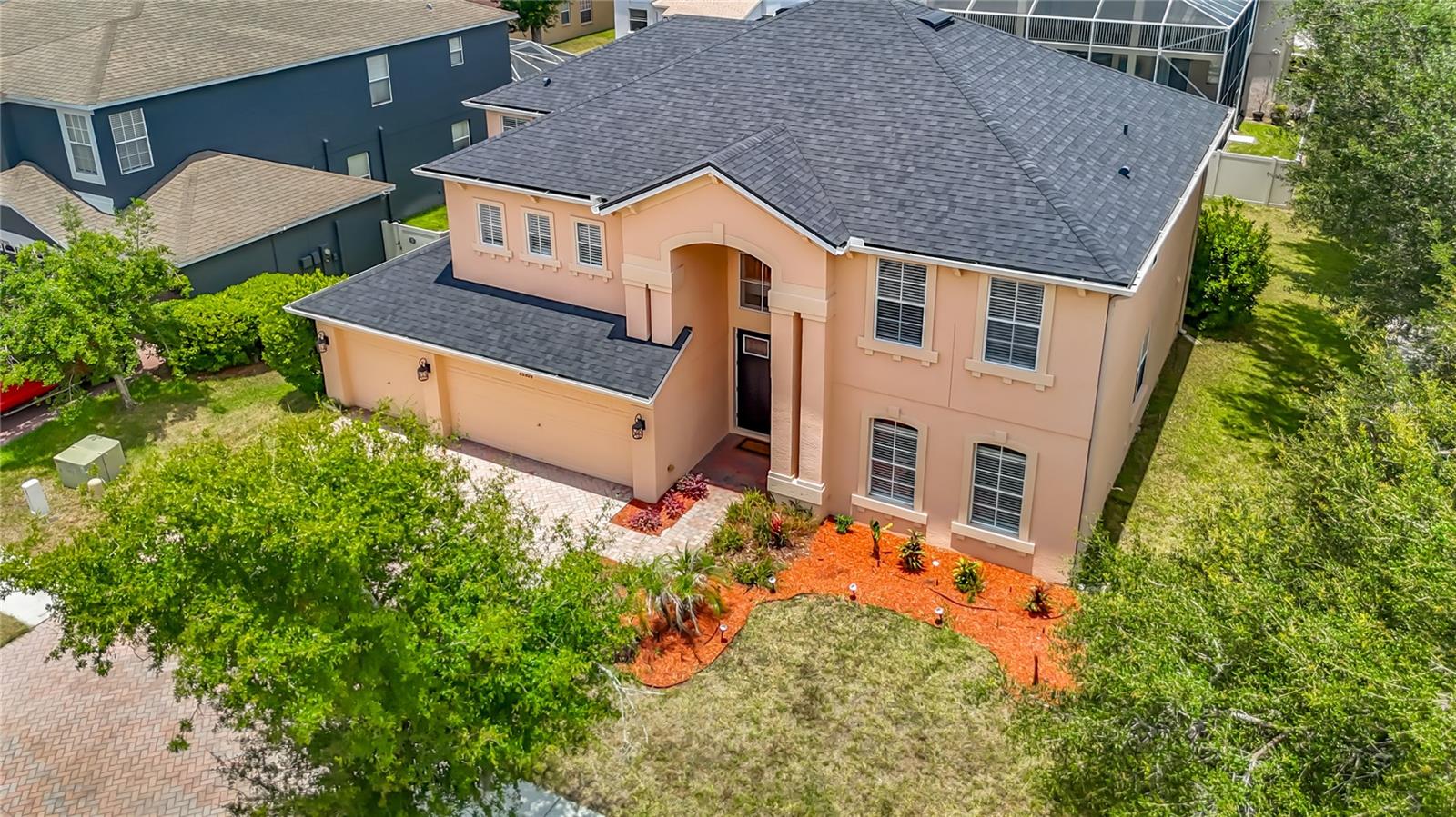 Welcome to 29909 Cedar Waxwing Drive in Wesley Chapel! This spacious 5-bedroom, 3-bath home offers approximately 3,446 square feet of beautifully designed living space with room for everyone. The heart of the home features a remodeled kitchen with modern finishes, completed approximately four years ago, along with tastefully updated bathrooms that provide a fresh, contemporary feel.  The guest room on the first floor has a full sized bathroom right next to it.  Making it easy to have guests in their own space.

Step outside to your own private oasis featuring a screened-in pool, perfect for relaxing or entertaining year-round. Upstairs, you'll find an oversized loft offering endless possibilities as a media room, game room, playroom, home office, or man cave.
Need activities?  The Grove, Outlet Mall, and the Krates are so close, as well as Boyette park.  Tennis, Soccer, activities building and much more.  You are right in the middle, yet established neighborhood with tree lined streets.

Additional updates include a new roof installed less than one year ago and window blinds throughout the home. With generous living spaces, stylish updates, and a versatile floor plan, this home is the perfect blend of comfort, functionality, and Florida living.