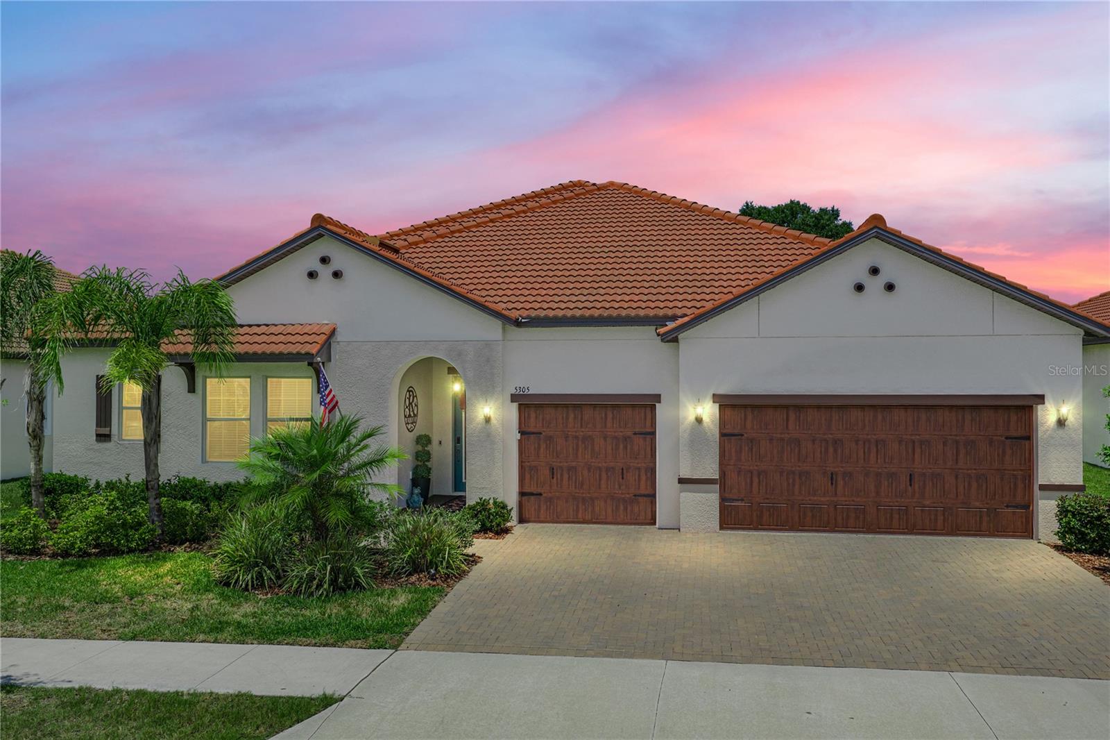 Welcome to luxury living redefined at 5305 Windy Grove Drive, located in the premier 55+ gated community of Medley at Southshore Bay. Perfectly positioned on a large EXECUTIVE Conservation View PREMIUM Lot, this exceptional 4-bedroom, 3-bath residence offers the space, privacy, and upscale finishes today’s buyers have been searching for — all wrapped into one stunning Florida retreat.

From the moment you enter, the attention to detail is undeniable. CROWN Molding, CUSTOM Architectural Ceiling details, DESIGNER lighting, and elegant finishes create a sophisticated yet welcoming atmosphere throughout the home. The expansive open-concept layout was designed for both entertaining and everyday comfort, seamlessly blending luxury with functionality.

At the heart of the home is a truly showstopping GOURMET kitchen featuring QUARTZ countertops, upgraded cabinetry, a gas cooktop,  CUSTOM BACKSPLASH details, an oversized island, and a FULLY CUSTOMIZED SHOWPIECE PANTRY featuring built-in wine racks, a wine refrigerator, and designer finishes that elevate the space with beauty and function.  There is a SECOND pantry EQUALLY SPACIOUS and is the perfect hidden storage for countertop appliances and everyday dry goods. This rare dual-pantry setup offers the kind of luxury and functionality buyers dream about but rarely find. 

The spacious primary suite is a private sanctuary complete with a CUSTOM BOUTIQUE-STYLE walk-in closet that feels more like a high-end dressing room than a traditional closet. Additional bedrooms and baths provide comfort and flexibility for guests, hobbies, office space, or multigenerational living.

Tucked away upstairs, you’ll find a rare and incredibly versatile 16x10 bonus storage space — the kind of feature buyers never realize they need until they see it. Whether you envision a climate-controlled holiday storage area, hobby room, private office, fitness nook, craft space, “man cave,” or an organized spot for all the extras that usually take over the garage, this hidden gem adds valuable flexibility and function to the home. In a world where storage is everything, this is a standout feature you simply don’t find every day.

Step outside to the OVERSIZED screened lanai designed for true indoor-outdoor Florida living. With multiple seating areas, beautiful privacy, and plenty of room to relax or entertain, this outdoor space becomes an extension of the home itself. The oversized lot provides added breathing room and a more private setting rarely found in community living.

Beyond the home, residents enjoy the unmatched Medley lifestyle including a gated golf-cart-friendly community, resort-style clubhouse, fitness center, pickleball courts, social events, and access to the incredible crystal lagoon with guest passes for family and friends. HOA benefits also include lawn maintenance, high-speed internet, cable, and premium streaming services including Disney+, Hulu, Paramount+, and more — creating both luxury and convenience in one simplified lifestyle package