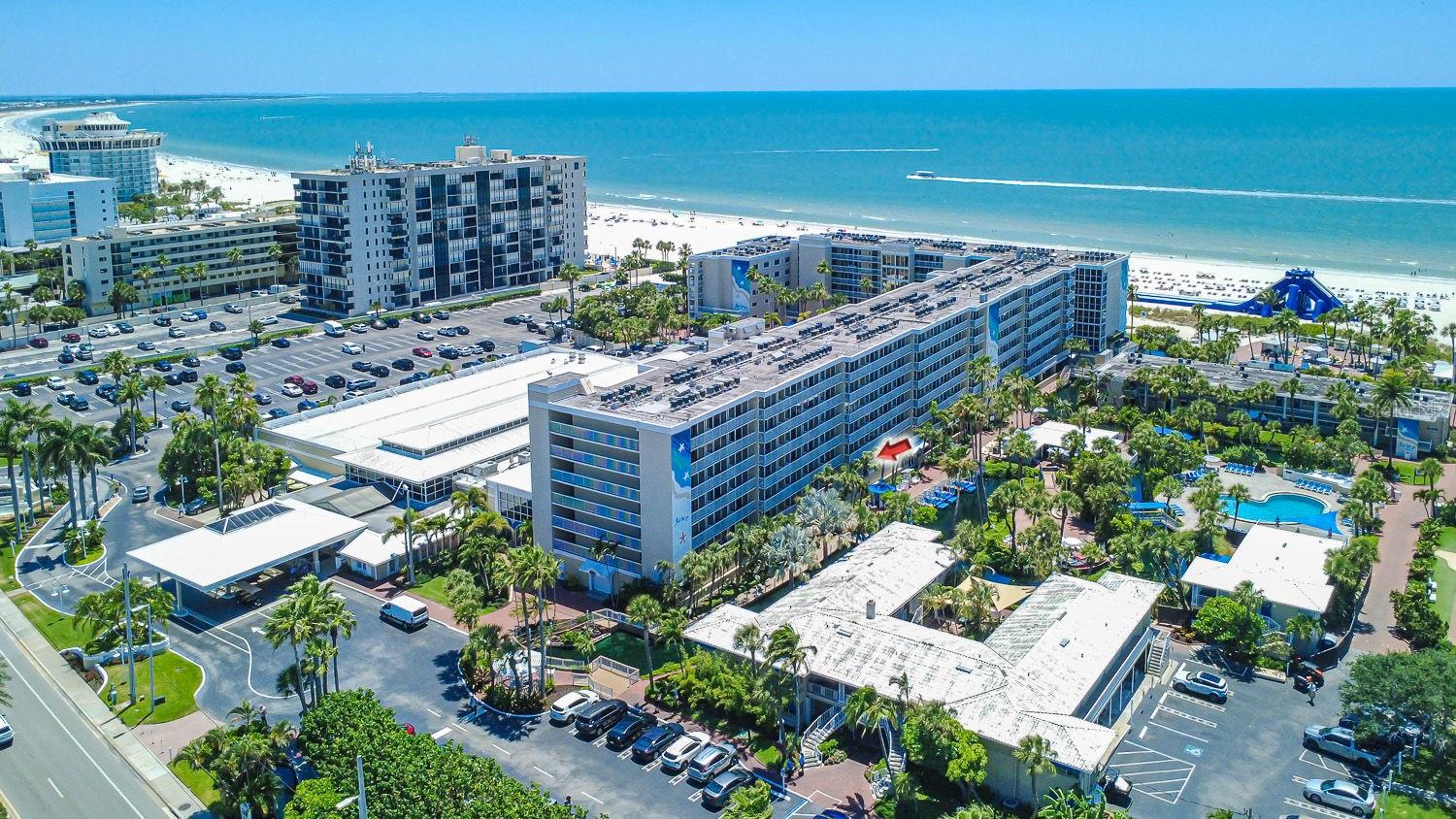 Enjoy a true resort-style beachfront getaway and income-producing opportunity at the iconic TradeWinds Resort on St. Pete Beach. This fully furnished 1-bedroom, 1-bath condo-hotel unit features peaceful tropical views from the private 2nd-floor balcony and is priced to sell.

Inside, the layout offers a comfortable living space with a convenient kitchenette featuring a mini-fridge, microwave, coffee maker, and additional essentials—ideal for short beach getaways or extended stays. Just outside the front entry, an oversized shared deck area provides additional outdoor seating space to relax and unwind.

This property is part of the TradeWinds on-site rental program, offering a true turn-key ownership experience with strong rental income potential already in place. Owners may personally use the property for up to 28 days per year while generating income the remainder of the time. Existing rental management agreement transfers to the new owner.

Spread across more than 40 beachfront acres with over 1,000 feet of Gulf frontage, TradeWinds offers an unmatched vacation experience with multiple pools, beach bars and restaurants, fitness facilities, tennis courts, water attractions, and activities for all ages. Whether you're looking for a personal beach retreat, investment property, or 1031 exchange opportunity, this is an excellent chance to own in one of St. Pete Beach’s most recognized resorts.