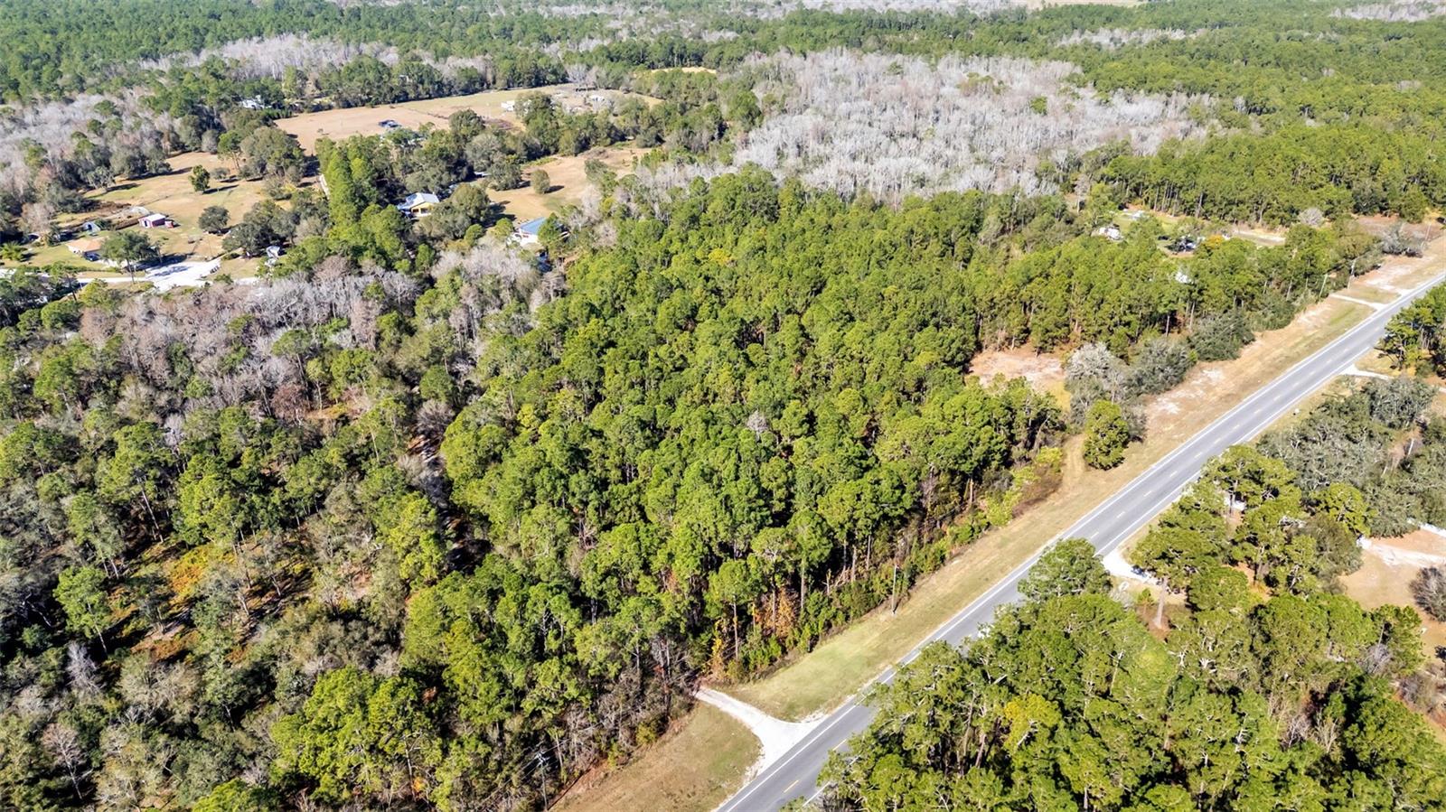 Welcome to your escape! This lot is zoned for Agriculture Residential Rural X and has been approved by the county for one single-family home. Please find more information in the attached documents. To help you get started, the seller is willing to clear a portion of the land for you. This beautiful site is the perfect place to bring your toys and build your dream home. Conveniently located near state parks and lakes with boat ramps, the property is also just a short distance from I-4. More pictures will be available soon. Please note that the property will need a well and septic system. Use 14979 Commonwealth Ave N, Polk City, FL 33868 in GPS to find lot across the street.