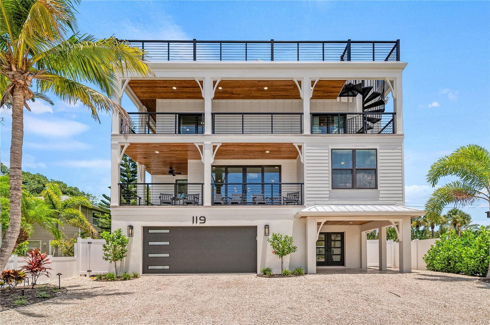 Luxury Living in the Heart of Siesta Key!

This beautifully designed coastal retreat offers 7 bedrooms, 7 full bathrooms, and 2 half baths, providing plenty of space for hosting family and friends in total comfort. Every detail was thoughtfully crafted to blend high-end design with relaxed Florida living.

The main living area is open, airy, and filled with natural light, creating an effortless flow for both everyday life and entertaining. A private elevator makes accessing all levels a breeze, while wraparound balconies and large windows showcase the lush, tropical surroundings.

At the center of the home, the chef’s kitchen features a gas range, oversized island, and ample seating—perfect for gathering, cooking, and connecting.

Step outside and you’ll find your own private escape: a heated pool and spa, putting green, and a spacious patio designed for making the most of every sunny day. Whether you're lounging poolside or enjoying a casual game of ping pong, this outdoor space was made for fun and relaxation.

Upstairs, the second level includes three luxurious king suites with private en-suite baths. The third floor offers four additional bedrooms—three more king suites and a bunk room with two full-over-full bunks, making it ideal for large families or groups.

At the top of it all, the rooftop terrace delivers incredible views of Siesta Key Village and the nearby beach. It’s the perfect spot to take in the sunset, sip a cocktail, or stargaze late into the evening. A built-in wet bar completes the experience.

This is a rare opportunity to own a one-of-a-kind home in one of Siesta Key’s most coveted locations. With stunning finishes, thoughtful amenities, and a true resort-style feel, this residence offers coastal living at its finest.

Schedule your private tour today.
