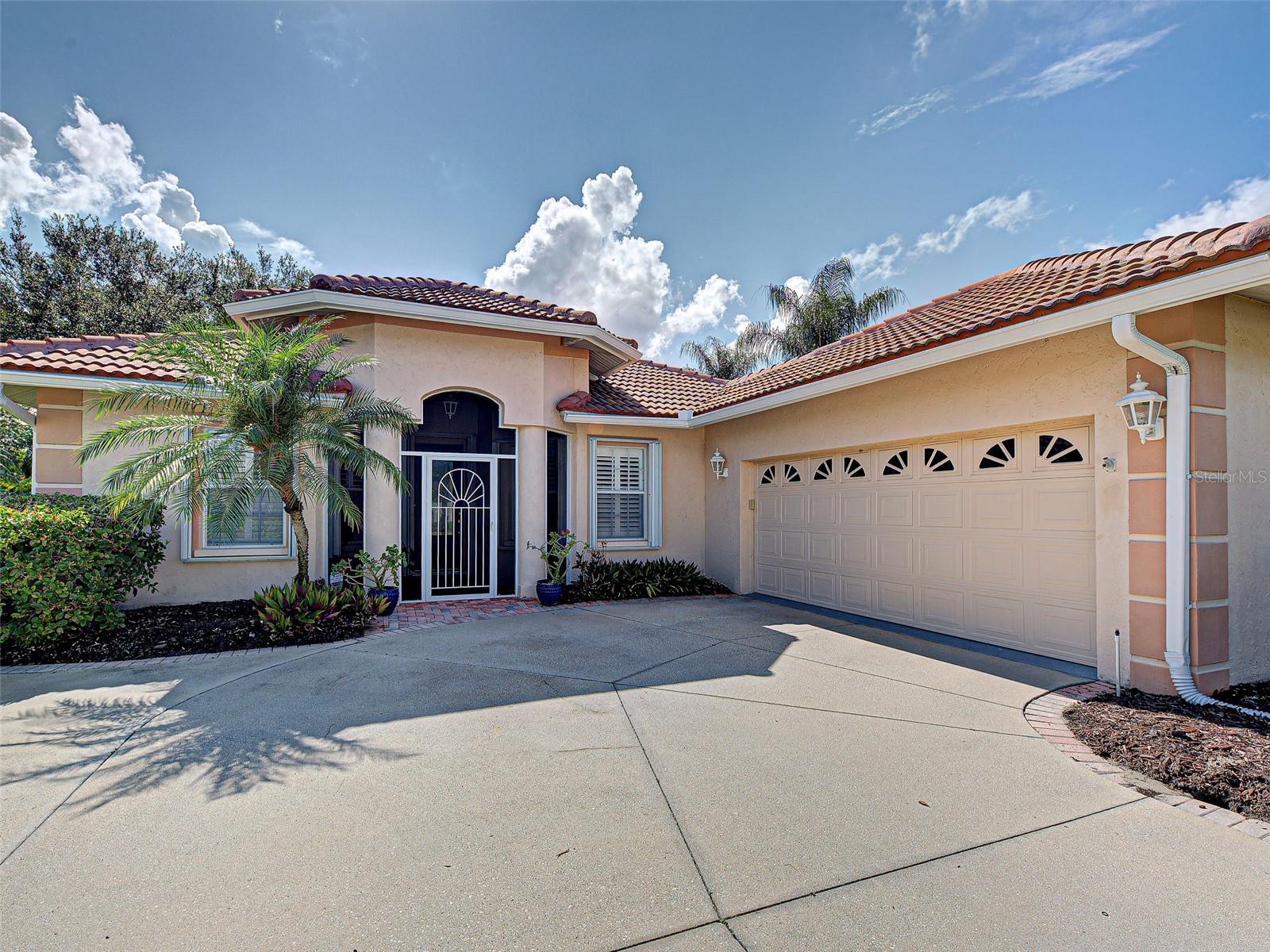 Welcome to Hidden Lakes Club, where comfort, space, and the Florida lifestyle come together in one beautifully maintained home. Situated on a corner lot in this gated Venice community, this 3-bedroom, 2-bath residence offers over 2,350 square feet of thoughtfully designed living space with an open floor plan, soaring ceilings, abundant natural light, and tranquil pond views.

From the moment you step through the front door, your eye is drawn through the spacious living and dining areas to the impressive 17' x 26' air-conditioned Florida room. Filled with natural light and peaceful pond views, this exceptional space extends your living area and creates the perfect setting for morning coffee, entertaining friends, enjoying a favorite book, or simply relaxing while watching the many birds that frequent the water.

The kitchen features granite countertops, a pantry, breakfast nook, and seamless flow into the main living areas, making everyday living and entertaining easy. A dedicated office/den provides flexible space for working from home, hobbies, or a quiet retreat. The private primary suite offers a large walk-in closet and an ensuite bath with dual vanities, garden tub, walk-in shower, private water closet, and dedicated makeup area. Guests will appreciate the privacy provided by the split-bedroom floor plan.

Step outside to the paver patio overlooking the pond and fountain, an inviting place to enjoy Florida's beautiful weather. The oversized laundry room includes a utility sink and additional storage closet, while the garage offers extra storage space for tools, seasonal items, and recreational gear.

Important updates include a new tile roof (2023), whole-house accordion hurricane shutters, repiped plumbing, and a new water heater (2025).

Hidden Lakes Club offers residents a gated entrance, clubhouse, community pool, fitness center, tennis courts, pickleball courts, and sidewalks throughout the neighborhood. Located less than a mile from I-75, you'll enjoy convenient access to Venice Island, Gulf beaches, shopping, dining, golf, medical facilities, Wellen Park, and all that Florida's Gulf Coast has to offer.

If you've been searching for a spacious, well-maintained home that captures the relaxed Florida lifestyle, this Hidden Lakes property deserves a closer look.