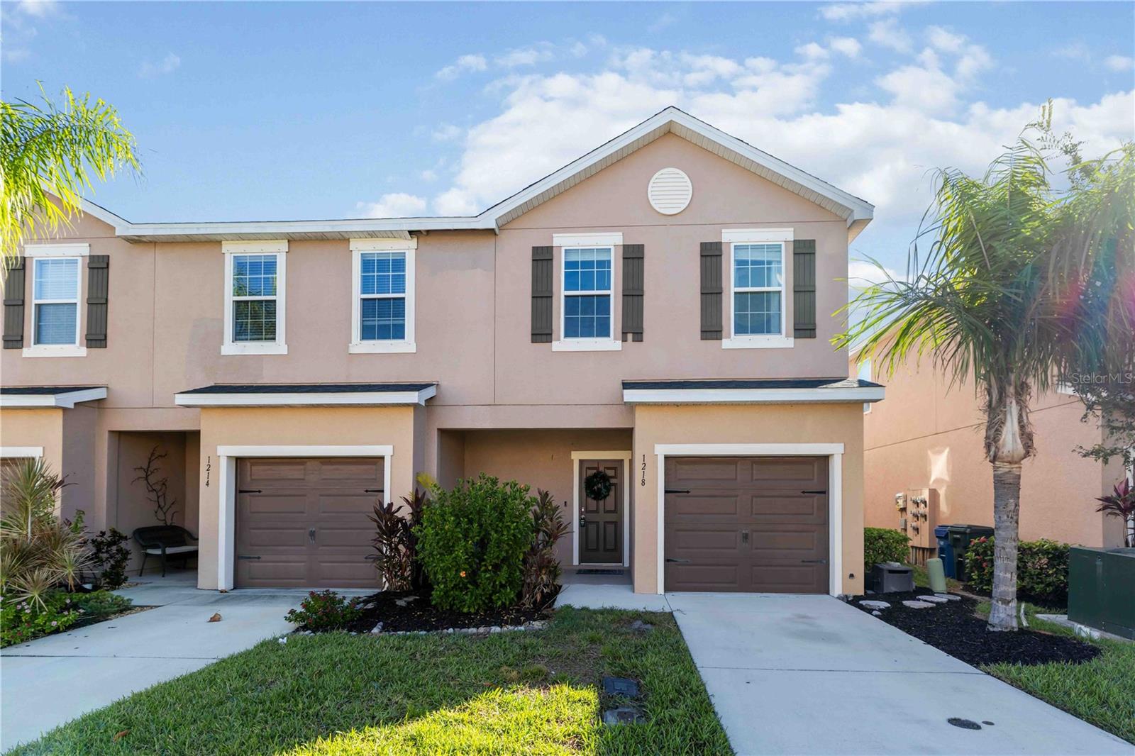 This beautifully maintained townhome sits within a secure gated community and offers 3 bedrooms, 2.5 baths, over 2,143 sq. ft., and a spacious screened patio. A covered entry leads into an open-concept layout with a welcoming foyer and ceramic tile flowing through the main living areas. The kitchen features granite countertops, espresso cabinetry, stainless steel appliances, a glass cooktop, pantry, and a large snack bar perfect for casual dining. The dining area accommodates larger gatherings and opens directly to the screened patio, while the living room offers soft carpet, recessed lighting, and plenty of natural light. The covered patio is ideal for morning coffee or evening relaxation, complete with lighting, ceiling fan, and ample seating space. A convenient half bath completes the main floor. Upstairs, the primary suite offers plenty of room for larger furniture, a walk-in closet, and an ensuite bath with dual sinks and a glass-enclosed shower. The second level also includes a full-size laundry area, a guest bedroom with private ensuite and double-sink vanity, a third bedroom, and a versatile bonus room perfect for an office, media space, or playroom. Enjoy resort-style amenities including a community pool, spa, and clubhouse. Located in a quiet neighborhood just minutes from St. Armand's Circle, Sarasota’s world-famous beaches, and less than 10 minutes to Sarasota/Bradenton International Airport—this home blends comfort, convenience, and Florida living at its best.
