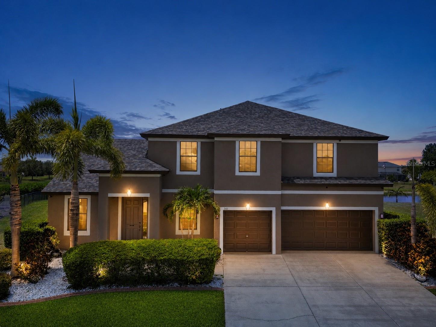 Heated pool and spa, tranquil pond views, and a brand-new 2024 roof — this beautifully updated 5-bedroom, 4-bathroom home in Apollo Beach's sought-after Harbour Isles community delivers the Florida lifestyle without the to-do list. With 3,295 square feet, a 3-car garage, and a flexible floor plan that lives like six bedrooms, this move-in-ready home offers space, quality, and true peace of mind. Major updates are already done for you: new roof (2024), upstairs A/C (2023), fresh interior and exterior paint, newly updated stainless steel kitchen appliances, a new 50-gallon water heater (2026), and luxury vinyl plank flooring throughout the second floor — upgrades that mean lower maintenance worries and easier insurability from day one. A Guardian security system adds convenience and protection. The first floor is built for flexibility. In addition to the formal dining room and a spacious family room overlooking the pool, a generous living room sits adjacent to a full bathroom — ideal as an in-law or guest retreat, home office, or easy 6th-bedroom conversion for multigenerational living. A separate flex room with pool views works beautifully as a game room, playroom, media room, or second office. At the heart of the home, the kitchen is designed for everyday living and effortless entertaining: granite countertops, abundant cabinetry, a large center island with built-in wine storage, a wine cooler, walk-in pantry, all-new stainless appliances, and a sunny breakfast nook opening to the covered lanai. Outside is your private Florida retreat. The screened, heated pool and spa overlook a peaceful pond framed by mature trees — no rear neighbors, just waterfront views and stunning sunsets from morning coffee to evening swims. Upstairs, the oversized primary suite offers a large walk-in closet and a beautifully appointed en-suite bath with dual vanities, a glass-enclosed walk-in shower, and a relaxing garden tub. Four additional bedrooms complete the second floor, including a private guest suite with its own full bathroom. A first-floor laundry room with washer, dryer, and built-in shelving, plus overhead storage racks in the 3-car garage, round out the practical touches. Harbour Isles residents enjoy resort-style amenities — clubhouse, community pool, fitness center, basketball and sand volleyball courts, playgrounds, walking trails, a fishing pier, and boat/RV storage — all for an HOA of only about $100 per year. Minutes from US-41 and I-75, you're an easy drive to Tampa, MacDill AFB, Gulf beaches, and the marinas and waterfront dining that make Apollo Beach special. Space, upgrades, water views, and one of the lowest HOAs in the area — schedule your private showing today.