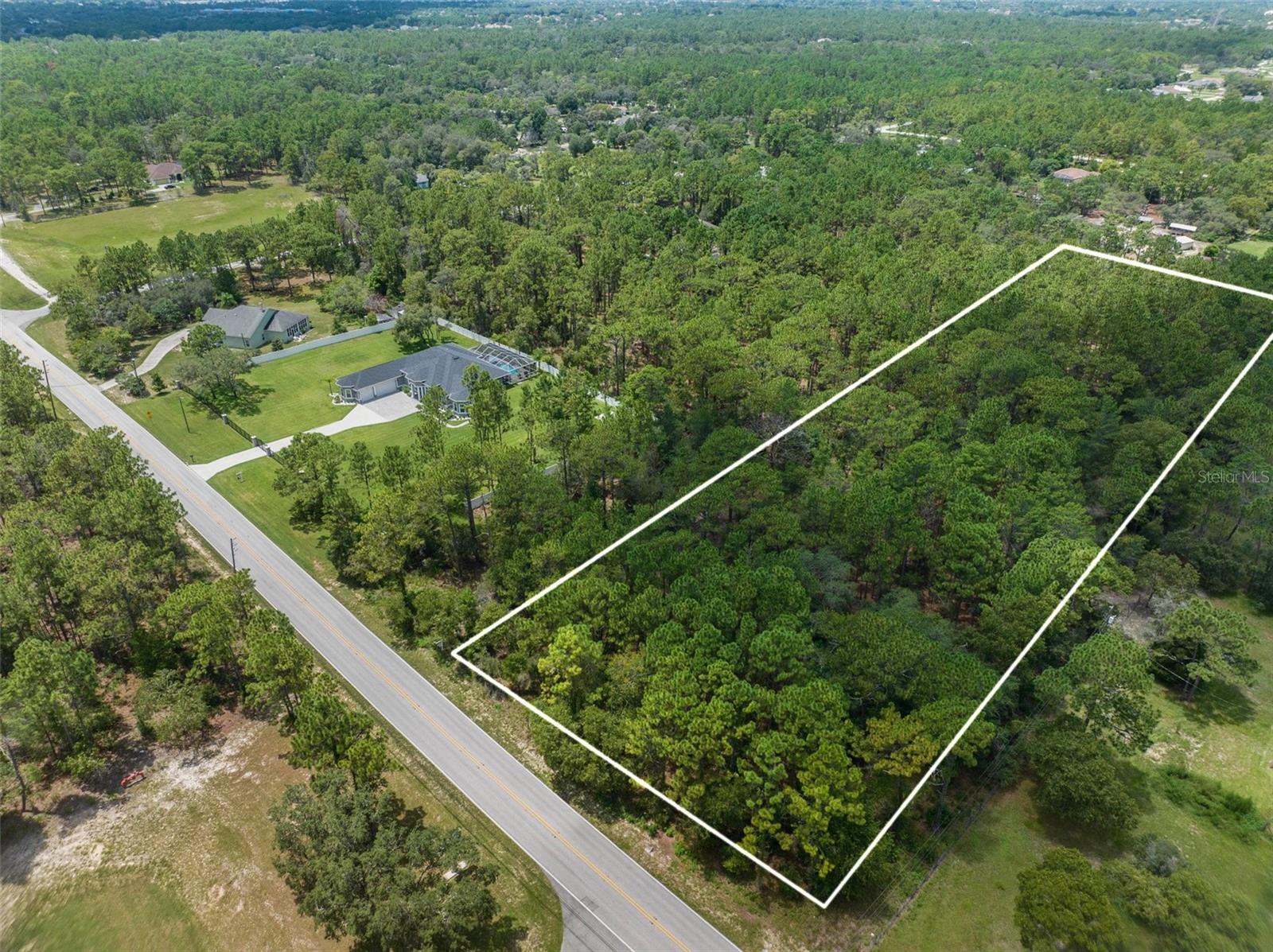 GORGEOUS 4.8 ACRES! Build your dream home on this beautiful wooded property! Clear out just enough for your home and yard...or clear it all into pastures and bring the horses! The house to the left of the property just sold for $1.18M. There are several large homes on the Barclay in a row near this property! It is also located in the center of Hernando County only minutes to EVERYTHING...minutes to Cortez/Hwy 50, minutes to Spring Hill Drive, minutes to the Suncoast Parkway for easy and quick access to Tampa for work and play! Minutes to multiple hospitals, grocery shopping, cafés, restaurants, movies, shopping, and more! 10 minutes to the Weeki Wachee State Park...home of the Mermaids and Buccaneer Bay Water Park, sunsets at Pine Island Beach, fishing and boating in Hernando Beach! 1 hour to TOP US Beaches! Come see this beautiful property on Barclay Avenue in the heart of Hernando County in the Brooksville/Spring Hill area! Great location! ZONED AR2 so bring the horses, pets, RVs, boats, ATVs, toys...bring it all!  NO FLOOD! Just a BEAUTIFUL area!