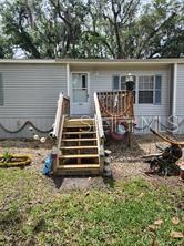 SELLER MOTIVATED BRING YOUR RV AND BOAT,PLENTY OF STORAGE.   HOME OFFERS THE BEST OF FLORIDA LIVING. TUCKED AWAY IN OLD HOMOSASSA FLORIDA.  THIS HOME HAS 3BED/ 2 BATH WITH SPLIT FLOOR PLAN.  INSIDE LAUNDRY WITH KENMORE WASHER, DRYER AND STORAGE CLOSET.   SPLIT FLOOR PLAN. "NEW A/C 2025" ALL BEDROOMS HAVE WALKIN CLOSETS.  LIVING ROOM HAS A REAL WOOD BURNING FIRE PLACE.  SCREENED PORCH IN BACK WITH NEW SCREENS, DOOR AND NEW ROOF. BACKYARD IS FENCED WITH OUT SIDE SHOWER.  HUGE CARPORT 20X30 THAT IS WIRED AND COVERED AND HAS A 9FT BY 6 OPENING SIDE BY SIDE AND UP AND DOWN AND HAS A 8X12 WORKSHOP.  MOVE I READY HAS NO HOA, HIGH SPEED INTERNET AND DIRECT T.V.  HOME CAN BE SOLD FURNISHED.  CALL TODAY