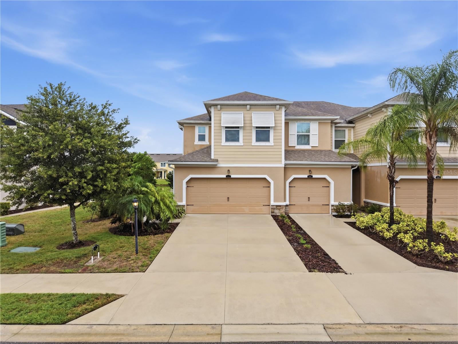Welcome to this beautifully maintained townhome in the sought-after Harmony at Lakewood Ranch community. Featuring the popular Seaside Craftsman floor plan, this home offers an open-concept design with stylish stone-colored cabinetry, stainless steel appliances, a spacious center island, breakfast bar, and 12x24 tile flooring throughout the main living area. The bright and inviting great room flows seamlessly to the screened private lanai, creating the perfect space for relaxing or entertaining. Upstairs, the spacious primary suite boasts a tray ceiling, dual vanities, a large walk-in shower, and two walk-in closets, while two additional bedrooms, a full bath, and a conveniently located laundry room provide comfort and functionality. Residents enjoy resort-style amenities including a clubhouse, pool, fitness center, playground, and walking trails, all just minutes from shopping, dining, top-rated schools, and the beautiful Gulf Coast beaches.