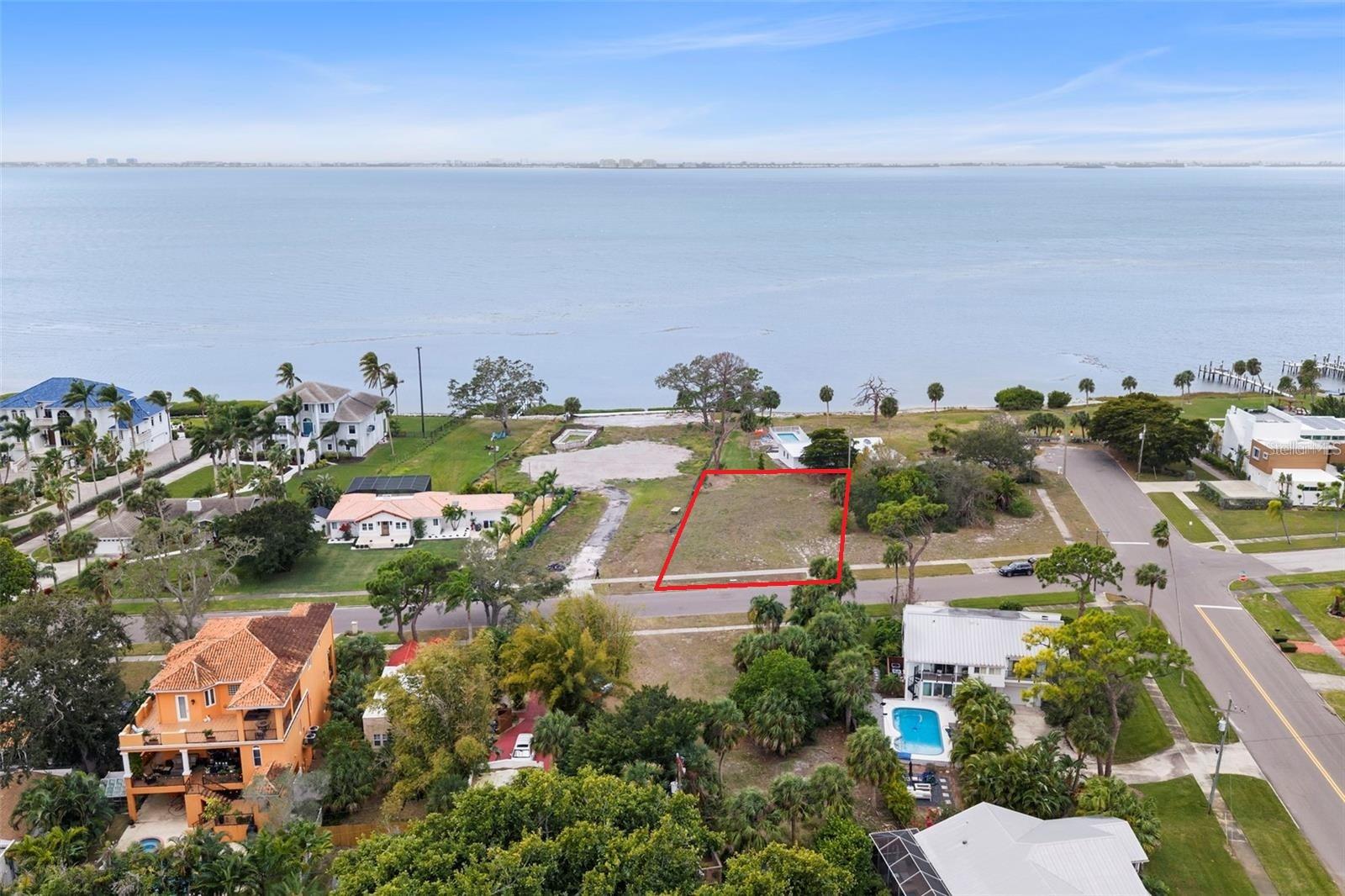 SEDUCTIVE SARASOTA BAY VIEWS!
Have you been spending countless hours staring at your phone into the wee hours of the morning, scrolling through properties that just don’t fit the bill… not to mention driving the wheels off your car every weekend since God knows when trying to find the needle in the haystack? WE HAVE THE FIX, so put down the phone and save your gas money for more important things.
Picture this… you’re sitting on the back porch of your NEW Florida Dream Home, overlooking the shimmering waters of Sarasota Bay, watching the sun dance across the horizon as seabirds glide overhead. No need to imagine being “close” to the water — this lot offers direct views of Sarasota Bay, delivering the coastal backdrop buyers dream about but rarely find.
Nestled in the peaceful and coveted Downtown Sarasota suburb of Whitfield Estates, flanked by iconic landmarks such as The Ringling Museum and surrounded by historic residences that have played host to some of the most esteemed members of high society for over a century, this property represents one of the few remaining opportunities to build in such a distinguished and established setting.
Whether you fancy yourself a developer looking to capitalize on the prestige of a West of the Trail address with panoramic water views, or an end-user ready to design and build a custom residence tailored to your exact vision, this lot provides the canvas. The optional HOA is only $30 annually, there are NO CDD FEES, and restrictions are minimal — giving you flexibility without sacrificing neighborhood character.
For boating enthusiasts, convenient access to Sarasota Bay is available via the public boat ramp at Bahia Mar West Marina, allowing you to be on the water in minutes. For the lifestyle seeker, you’re just moments from the shops and dining of Downtown Sarasota, St. Armands Circle, and some of Florida’s most world-renowned beaches — close enough to enjoy, yet far enough to retreat into your own waterfront sanctuary.
It’s commonly been said, “The value is in the land.” And in this case, the value is in the land… and the view. They aren’t making any more waterfront parcels overlooking Sarasota Bay.
DO NOT ALLOW THIS OPPORTUNITY TO SAIL OFF INTO THE SUNSET WITHOUT YOU!