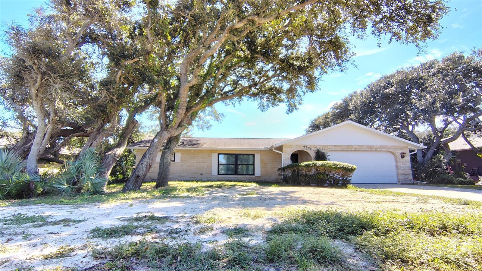 Welcome to 4790 Michael Lane, a charming single-family home located in the beautiful coastal town of Ponce Inlet, FL. This well-maintained residence was built in 1988 and offers a cozy and inviting atmosphere for its new owners.This property provides ample outdoor space for relaxation and entertainment. The lush landscaping and mature trees surrounding the home create a serene and private setting for residents to enjoy.  The layout of the home is thoughtfully designed to maximize comfort and functionality, with an open-concept living and dining area that is perfect for hosting gatherings with family and friends. A master bedroom, full bath and large walk in closet occupy one wing of the home, which leads to the pool through custom french doors. Two bedrooms and another full bath occupy the other wing, which also leads to the pool deck. This offers residents and guests both privacy and easy pool access.The kitchen is equipped with modern appliances, ample cabinet storage, and a large, central granite bar for casual dining. The bedrooms are spacious and offer plenty of natural light, providing a peaceful retreat for rest and relaxation. Bedroom floors and bathrooms are ready to be styled to your dream vision. All boast large closets with fully mirrored doors. Other highlights of this property include a two-car garage, an open air pool, and a backyard that is ideal for outdoor activities and hobbies. Whether you're looking to host a barbecue, cultivate a garden, or simply unwind in the sunshine, this home has everything you need to make the most of Florida living. Neither pesticides nor fertilizers have been used on the grounds, making the property organic and safe for animals and children.In addition to its charming features and convenient layout, 4790 Michael Lane is located in a desirable neighborhood known for its peaceful ambiance and proximity to local amenities. Residents can enjoy easy access to the beach, parks, dining and more, making it a truly idyllic place to call home.Important recent improvements include, custom front hurricane door, custom double hung windows in main areas, new HVAC and ductwork, new sockets and switches throughout, new soffit and gutters, new Hardie board siding and brand new top quality paint job. The septic field was replaced in 2025, providing an important update. The aluminum fence surrounding the backyard is also new and provides swing shut, locking gates. The interior main area is equiped with light reflective USA made VCT flooring that is recyclable. The ceiling fans are also new and the chimney was rebuilt to provide a ready-to-use wood burning fireplace. There is new, dimmable recessed lighting in the kitchen and the library and dining room light fixtures are vintage. Many thoughtful improvements have been made to adhere to energy efficiency and USA made updates. Overall, this property offers a wonderful opportunity for buyers seeking a comfortable and stylish home in a sought-after location. Don't miss your chance to make 4790 Michael Lane your own and start living the coastal lifestyle you've always dreamed of.