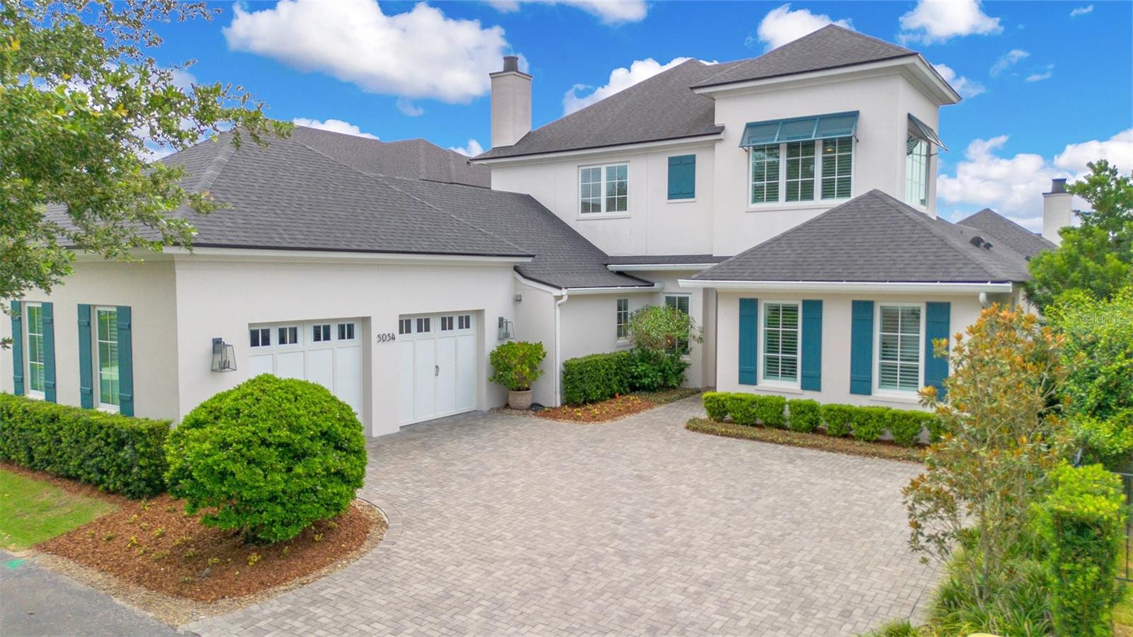 EXCLUSIVE LAKE LIVING IN BALDWIN PARK. Step into the world of luxury living in Baldwin Park and discover this oasis that awaits you. This waterfront masterpiece, built in 2020, offers stunning lake views, exceptional craftsmanship, by Cahill Homes and a well-thought-out floor plan. Enjoy the tranquility of overlooking Lake Susannah and the adjacent park from the outdoor space of this home. Perfect for entertainment or relaxation, the outdoor living areas are enclosed with motorized retractable screens, a gas fireplace, a summer kitchen, and a saltwater pool with a sun shelf. An expansive travertine paver deck is enclosed with an aluminum picket fence and lush landscaping. Artificial turf allows for maintenance free green space. A private gate and wall provide access to the linear park and extensive trail network throughout the neighborhood.
<br></br>
Upon entering the bright and open living space with a gas fireplace and custom built-ins, you'll be greeted with sliding glass doors that frame views of the outdoor living space, pool, and the serene lake beyond. A private front-facing office/flex room with barn doors offers an ideal workspace. The impressive kitchen boasts a large quartz island and Monogram appliances, including a 6-burner gas cooktop, two ovens, 48” refrigerator and freezer, and a wine refrigerator. The back kitchen is equipped with a second prep sink, full dishwasher, and floor to ceiling pantry cabinetry.
<br></br>
The first-floor primary bedroom features pool and lake views, a luxurious custom closet with an island and spa like primary bathroom. A second bedroom downstairs with en-suite bathroom is presently used as a craft room but easily coverts to a convenient space for guests. Expansive staircase tucked behind the kitchen provides access to the second floor offering three bedrooms, a powder bath off the bonus room, and a second laundry room. The game room with vaulted beam ceilings is filled with natural light, custom built-ins, a wet bar complete with mini-refrigerator and dishwasher. Triple windows provide a long view over Lake Susannah.
<br></br>
The oversized 2-car garage features insulated garage doors, epoxy floor and tons of storage cabinets.  Walking distance to Village Center featuring Publix, casual dining and new high-end restaurants Camille and Sorekara. Bike to East End market, Winter Park’s Park Ave., and short drive to downtown Orlando and Orlando International Airport.
<br></br>
<div style="padding:56.25% 0 0 0;position:relative;"><iframe src=https://my.matterport.com/show/?m=uRQFyWrkNgQ&mls=1 frameborder="0" allow="autoplay; fullscreen" allowfullscreen style="position:absolute;top:0;left:0;width:100%;height:100%;"></iframe></div>