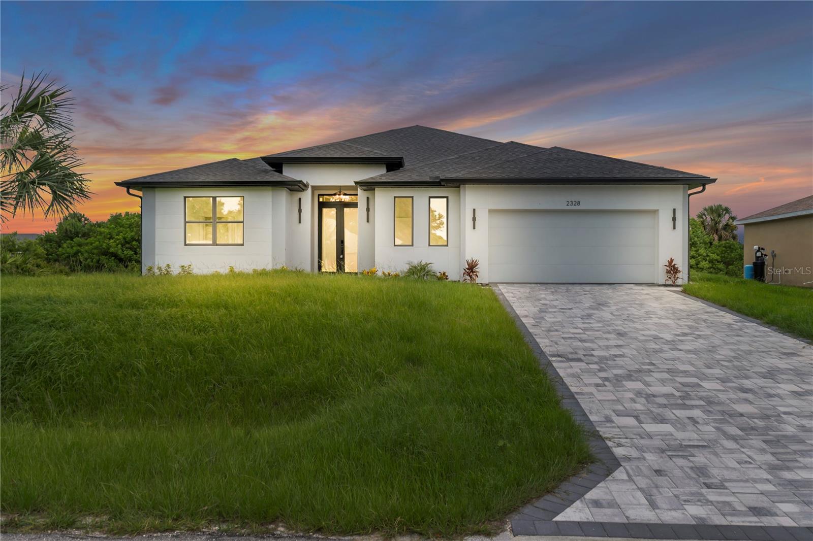 New construction home with no HOA and located outside of a flood zone, featuring 3 bedrooms plus a den and 2 full bathrooms, along with a private in-law suite that includes 1 bedroom, 1 bathroom, and a separate kitchen. The open-concept floor plan features spacious living and dining areas connected to a well-designed kitchen, while impact-rated windows and doors provide added durability. Additional features include a garage and flexible bonus space suitable for a home office, guest accommodations, or other residential use. Situated on a 10,000 sq ft lot, the property provides ample outdoor space and a functional layout designed to accommodate a variety of living arrangements.