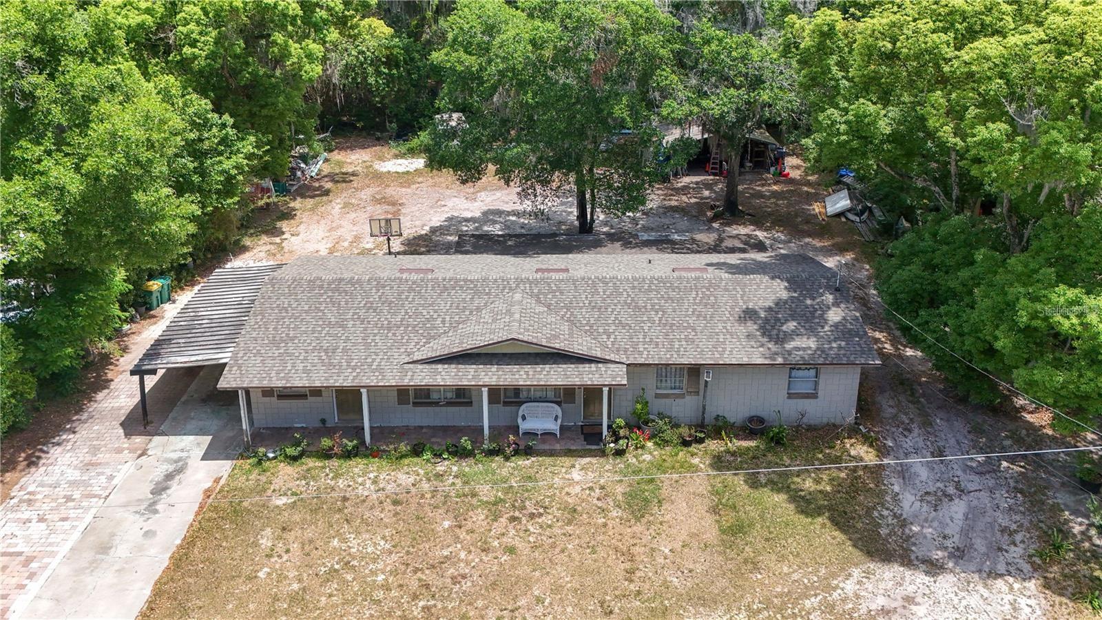 This spacious 3/2 is close to virtually everything Mount Dora has to offer.  Just up the street nearing completion is a brand-new Community Resource and Recreation Center.   A mere three blocks away is the Mt. Dora Community Pool (heated and open all year) and “Splash Pad”.  Just beyond the pool are tennis courts, multiple ball fields and a complete recreational complex.  Travel another 100 yards to the Dog Park.   Proceed a few more blocks down Unser St. and you’ll reach the renowned Ice House Sonntag Community Theatre known for top flight live entertainment.    Downtown Mt. Dora, a City of Festivals, with its wealth of outstanding restaurants and abundance of quaint little shops is less than a mile away.   The Lake Dora waterfront with all its opportunities for boating and wealth of water sports are literally at your doorstep!     The world famous Renninger’s Markets just a short hop across the Orange Blossom Trail.  This home with a NEW roof a year ago offers two very large bedrooms with a more modest third.   The home also features an oversized Great Room along with a dining room adjacent to a large kitchen which offers plenty of elbow room for the most enthusiastic of cooks.    The covered lanai provides a touch of the outdoors even when the Florida weather isn’t cooperating..  Lastly, an oversized shed in the very generous rear yard provides plenty of room for all those extras.   With the new SR 453 SPUR to the SR 429, Wekiva Parkway, just minutes away- downtown Orlando, Disney, Universal and the International Airports are all less than an hour away.    Come and enjoy the best Central Florida has to offer, come move  to Lake County and Mt. Dora.