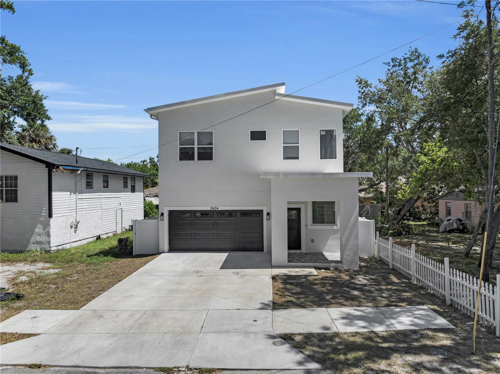 Welcome to this stunning 4-bedroom, 2.5-bath home offering approximately 2,000 square feet of thoughtfully designed living space. Nestled on a quiet dead-end street, this home combines privacy with modern comfort. Step inside to an open-concept layout featuring spacious living areas, an oversized kitchen island, elegant gray shaker cabinets, granite countertops, and stainless steel appliances. The primary suite and generously sized bedrooms provide plenty of room for family and guests. Enjoy outdoor living in the fully fenced backyard with a covered lanai—perfect for entertaining or relaxing. Conveniently located just minutes from Downtown Tampa, Ybor City, shopping, dining, and major highways. Don’t miss this opportunity to own a beautiful move-in-ready home in a rapidly growing area!