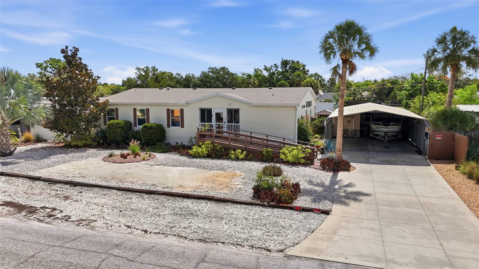 Over 2,300 square feet, three bedrooms, three bathrooms, no HOA, and your own land in a non-flood zone under $300K. In Southwest Florida, that combination is nearly impossible to find, and this is it.
This move-in ready manufactured home has been well maintained and thoughtfully updated. The 2024 roof and 2021 AC are already done, Septic replaced in 2025 , one bathroom has been fully renovated, and fresh paint in the main living area. 
Inside, cathedral ceilings and an open floor plan create a bright, spacious feel that the square footage backs up. The primary suite is oversized with a private sitting area, perfect as a home office or lounge. The opposite wing features two bedrooms with their own shared living space and bath, functioning beautifully as a guest suite or in-law quarters.
Outside, the fully fenced yard offers real privacy along wood deck and screened front porch. Storage is exceptional with a 4-car carport, a storage room, and shed. County water handles daily use while a separate irrigation well keeps landscaping costs down. No flood insurance required. Nearby Sarasota County maintained boat ramp allows quick access to Dona Bay and The gulf of Mexico.

Located less than 3 miles to Nokomis Beach and minutes to Venice dining, shopping, and I-75 access.