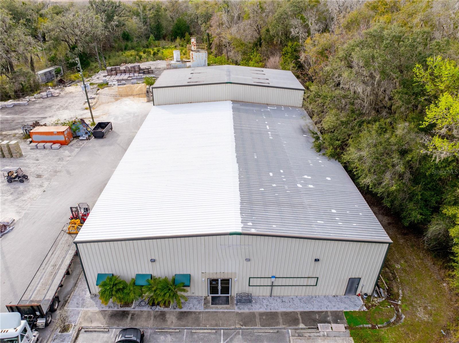 **Ask about Owner Financing** Welcome to an impressive industrial facility nestled in the heart of Hernando County, Florida. This expansive property spans a total of 11.1 acres, comprising two parcels of land strategically designed to accommodate a range of industrial needs. The front 5.4 acres are zoned PDP (HC) with C4 use, providing flexibility for various commercial applications, while the rear 5.7 acres are zoned AG, offering additional space for diverse industrial activities.

Dominating the landscape is a robust 12,000-square-foot metal building situated on the front parcel. This structure has been meticulously crafted to meet the demands of heavy industrial operations. The building features a spacious 1,088-square-foot air-conditioned office space, complete with a reception area, bathroom, and a kitchenette, ensuring a comfortable and functional workspace.

The foundation of the building boasts a heavy 8-inch concrete slab, specifically engineered to support heavy machinery and provide a stable platform for industrial processes. The strategic design includes three large bay doors, facilitating the seamless movement of heavy equipment in and out of the facility. These doors enhance operational efficiency and contribute to the overall functionality of the space.

Powering the facility is a robust 480V 3-phase power system, meeting the high-energy demands of industrial machinery and equipment. The property is secured with fencing on both sides, while the front entrance is equipped with fencing and a gated access point, ensuring controlled entry and heightened security.

In addition to its industrial prowess, the property is equipped with a well and septic system, providing essential utilities for day-to-day operations. The building itself reaches an impressive height of 20 to 30 feet, accommodating the needs of various industries and allowing for the efficient storage of large equipment or inventory.

Whether you are seeking a prime location for manufacturing, warehousing, or industrial operations, this property in Hernando County stands as a testament to versatility, functionality, and strategic planning in the realm of industrial real estate.
