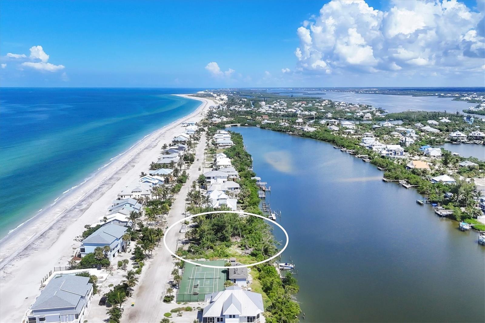 This vacant waterfront lot is located on Don Pedro/Palm Island.  Just across a sandy lane to your deeded beach access.
This lot offers full water views of Bocilla Lagoon, approximately 350' across and possible partial views of the Gulf of Mexico.  Plenty of room for a private dock with possible 2 lifts and a swimming pool.  The adjacent lot to the north offering the same possibilities, is currently not listed for sale but seller may consider selling that parcel with the listed property.  With both lots that will give you approximately ½ acre and the opportunity to build two homes with the potential to have a great family compound.  The 2024 tax bill is based on 2 lots.  The lots have been legally separated and the county has not established a new tax bill at this time, so the tax showing on the MLS was divided to give an approximate property tax amount.  Buyer or Buyers agent should verify this amount.