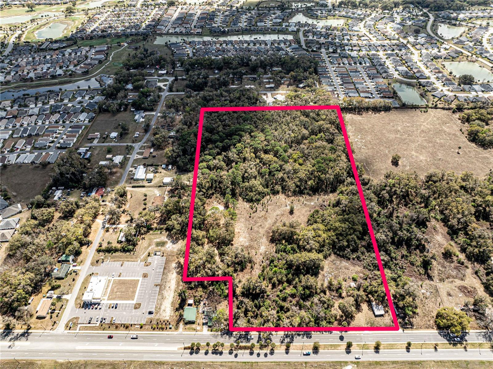 Exceptional 20.31-acre development opportunity located on Warm Springs Avenue in the heart of one of Central Florida’s fastest-growing corridors. This property boasts approximately 580 feet of frontage on Warm Springs Ave and is strategically positioned near the rapidly expanding areas surrounding The Villages, including the major growth hubs of Eastport and Middleton along the U.S. Highway 301 corridor. With significant regional growth and development activity nearby, this parcel offers tremendous flexibility for future development. Potential rezoning options allow for Mixed-Use, R-4 Residential (up to 12 units per acre), Planned Unit Development (PUD), and other commercial or residential uses, making it well suited for a variety of projects. The surrounding area continues to see substantial investment with nearby medical offices, retail centers, professional office space, and multifamily developments, reinforcing the strong demand for additional residential and commercial services. Utilities are already available to the site, including a 12-inch water main on the south side of Warm Springs Ave and a 4-inch force main on the north side, providing valuable infrastructure for future development.With its size, frontage, infrastructure, and location, this property is ideal for build-to-rent communities, multifamily housing, retail centers, professional offices, or mixed-use projects. Convenient access to U.S. Highway 301, County Road 470, Florida's Turnpike, and Interstate 75 makes this a strategic location for long-term growth and investment. Don’t miss this opportunity to secure a large-scale development site in one of Central Florida’s most dynamic expansion areas. Call today to discuss your next project.