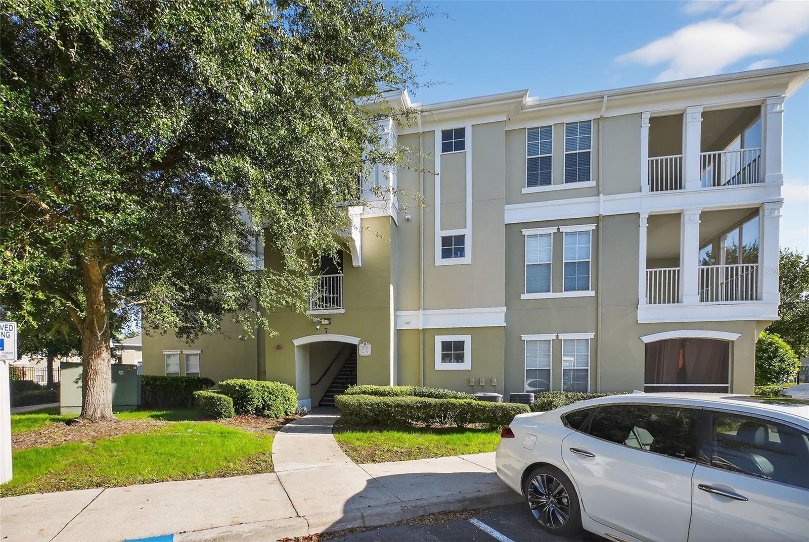 Welcome to this well-maintained 2 bedroom, 2 bathroom condo in the gated Gardens of Bridgehampton community. Located on the 2nd floor, this home offers an inviting layout with great natural light and comfortable living spaces throughout. One of the standout features is the large screened-in porch, perfect for morning coffee, unwinding in the evenings, or enjoying Florida weather year-round. Inside, the primary bedroom features an en-suite bathroom, while the secondary bedroom is conveniently located near the hall bath — ideal for guests or a home office. A rare perk: this unit includes an additional private storage closet right outside the front door. Recent updates include a new HVAC, new water heater, new refrigerator, and new dryer, giving you added peace of mind. Located just a short walk to the community pool and fitness center in a well-maintained, gated setting. Thoughtfully updated, and move-in ready, this condo is an exceptional find. Come see it for yourself!